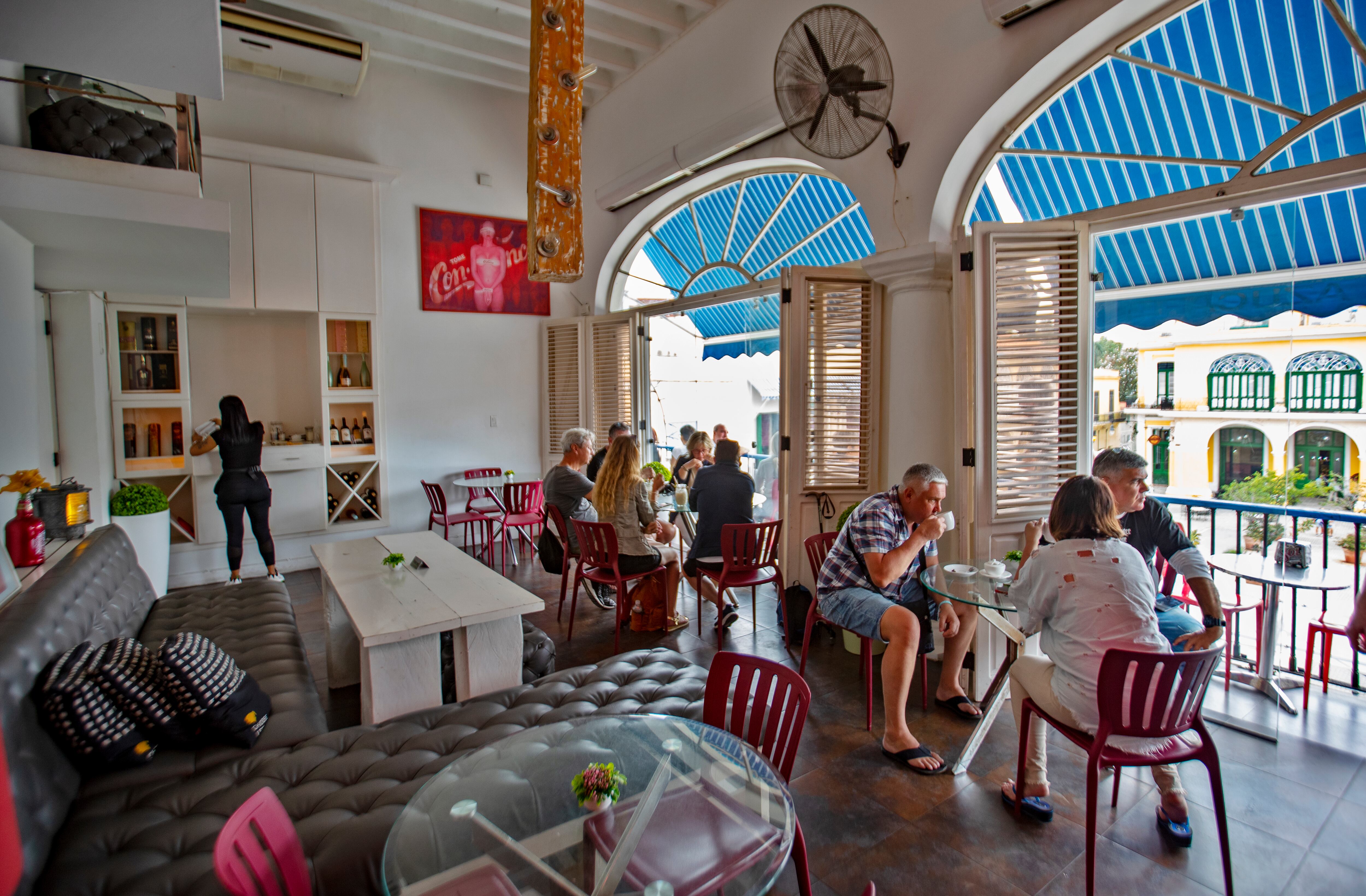 Clients at Café Azúcar, a private business located in Old Havana, Cuba.