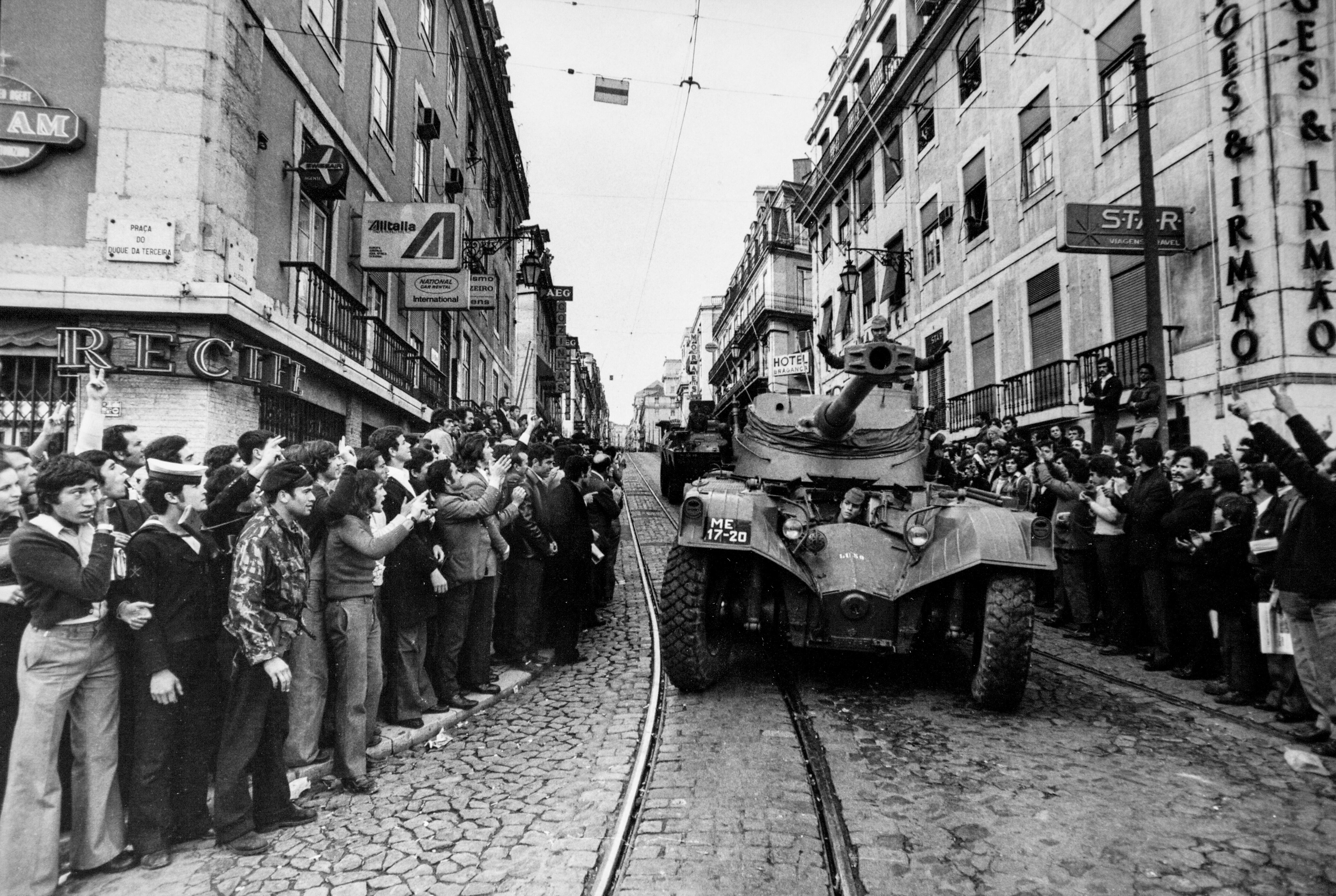 Citizens cheer soldiers in armored vehicles on April 25, 1974, on a street in Lisbon.