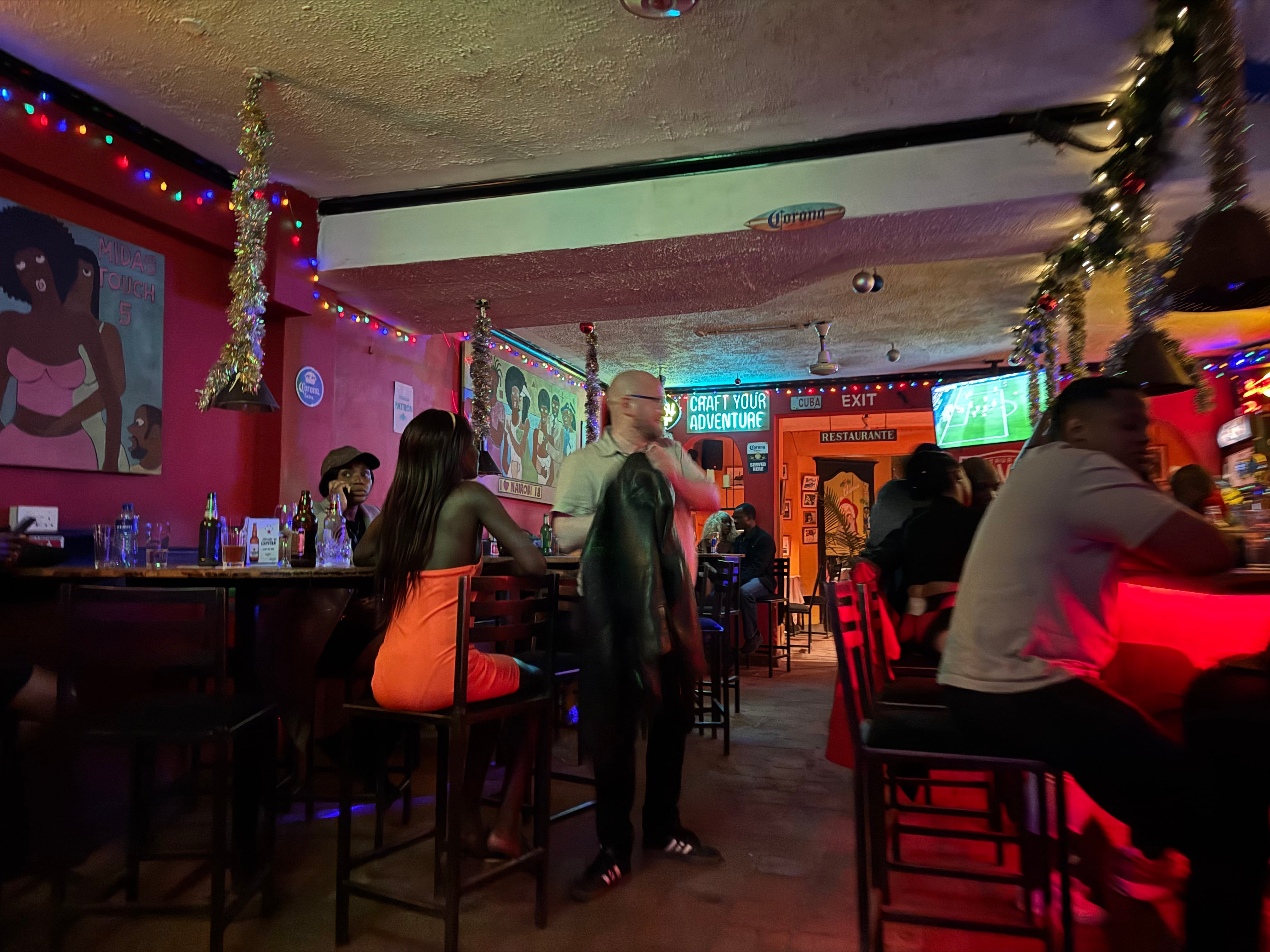 A European man and a young Kenyan woman in a Nairobi establishment, one of the “hot spots” for sex work mentioned by Mary, on December 28, 2024.
