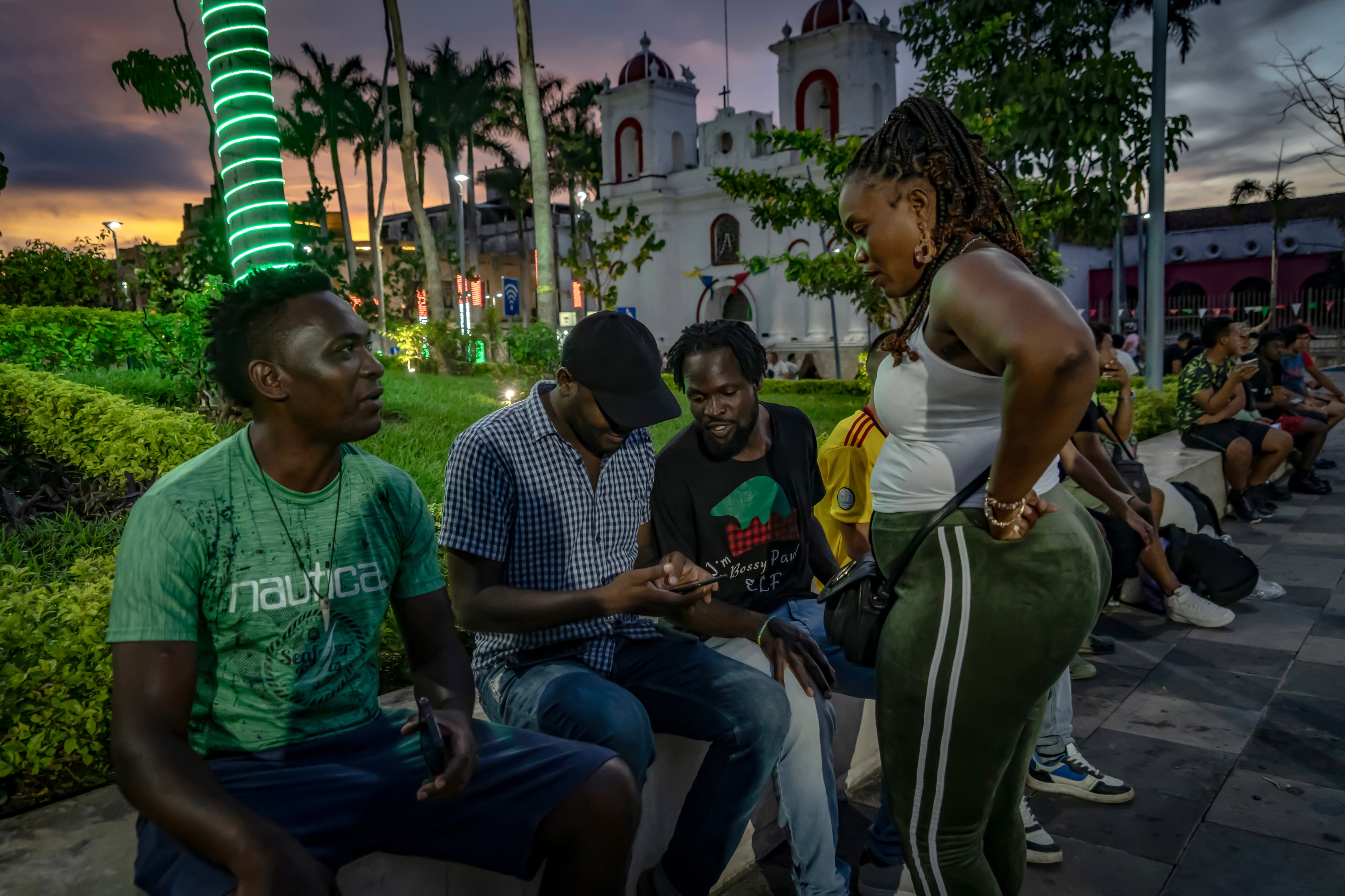 A family of Haitian migrants takes a break in Miguel Hidalgo Central Park, in Tapachula, Chiapas.