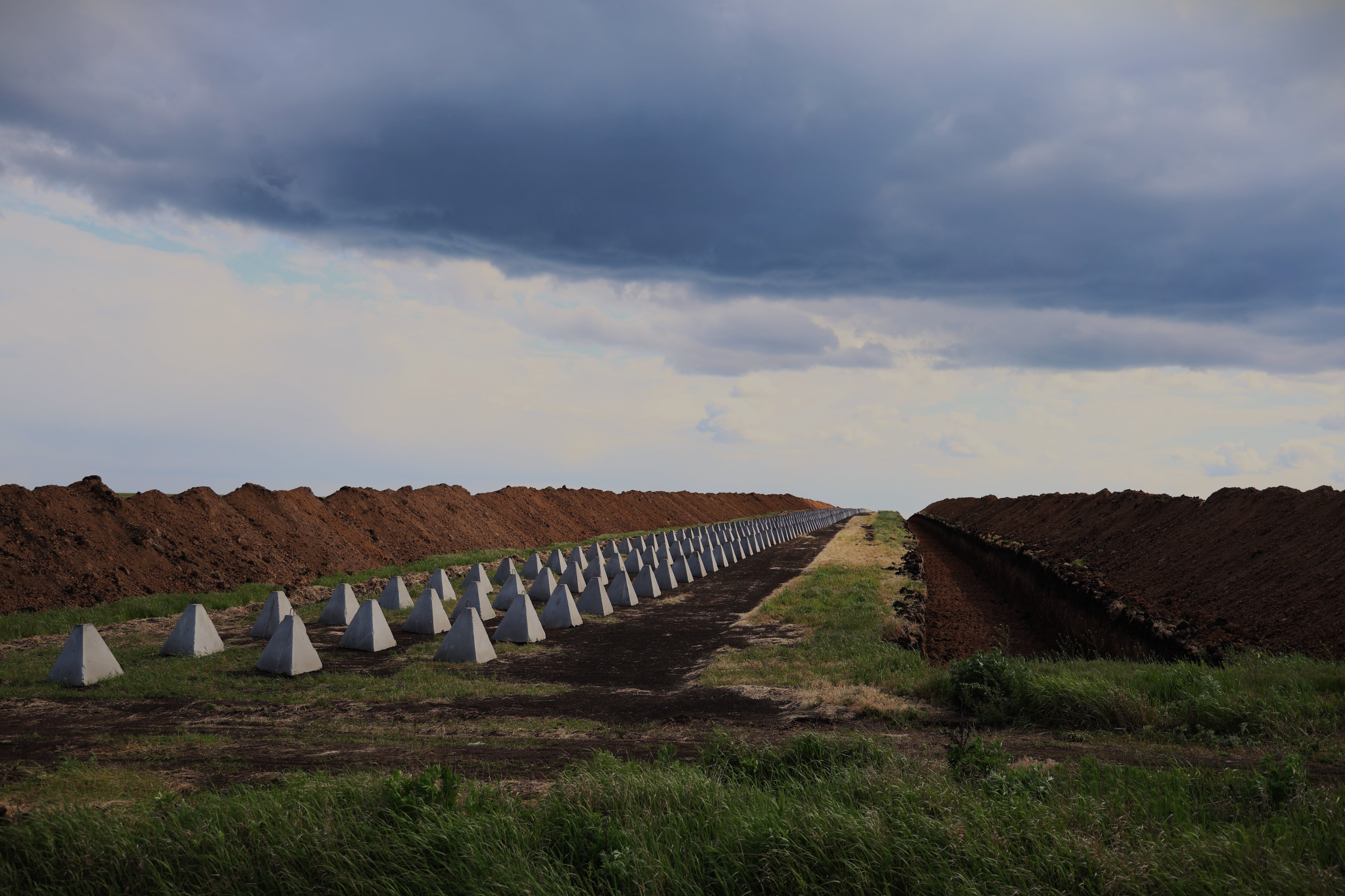 Trenches, earthen mounds, and dragon's teeth to impede the advance of Russian troops in the Donetsk region.