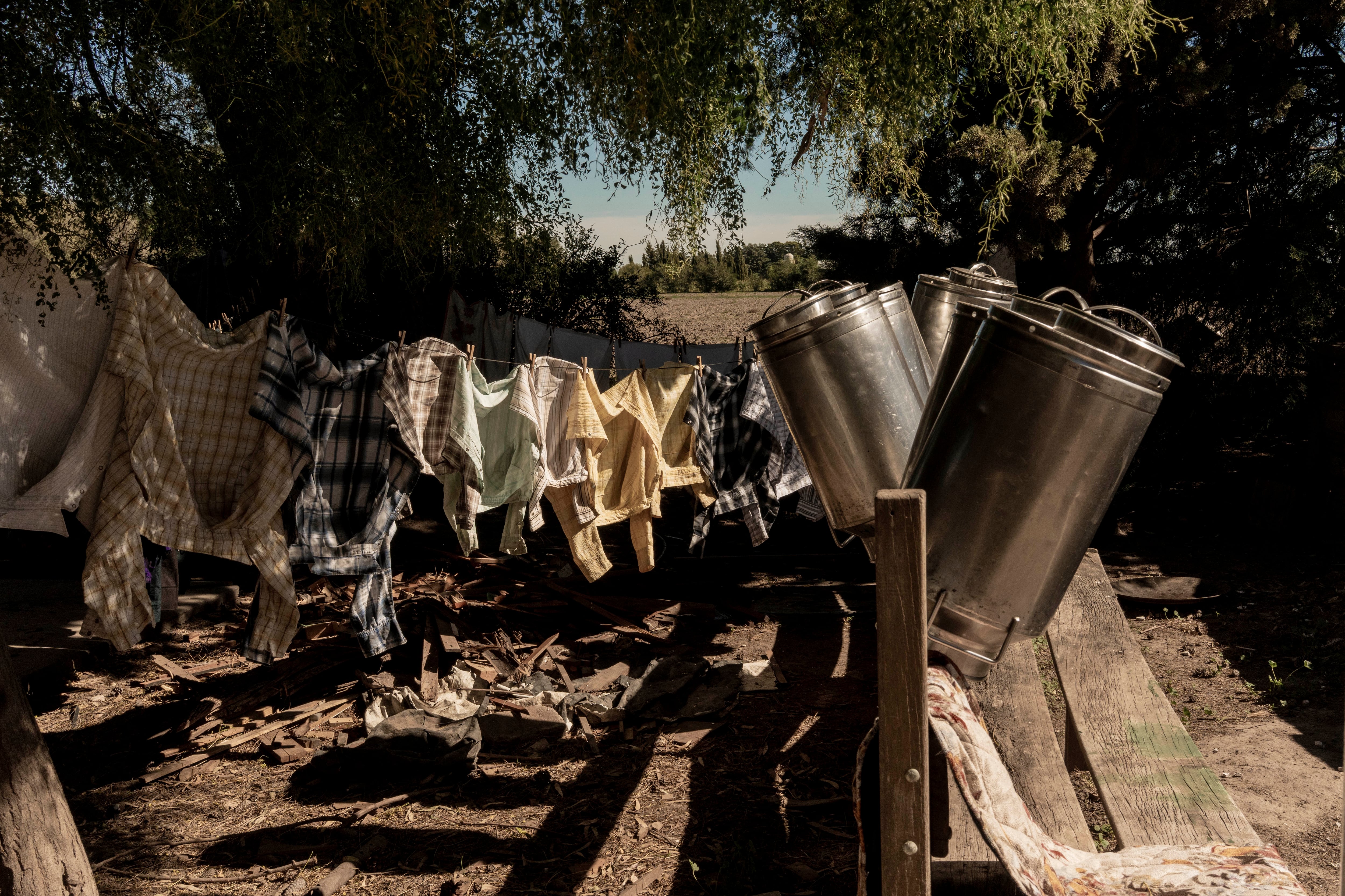 Milk jugs and clothes drying in the sun, in the La Nueva Esperanza neighborhood.