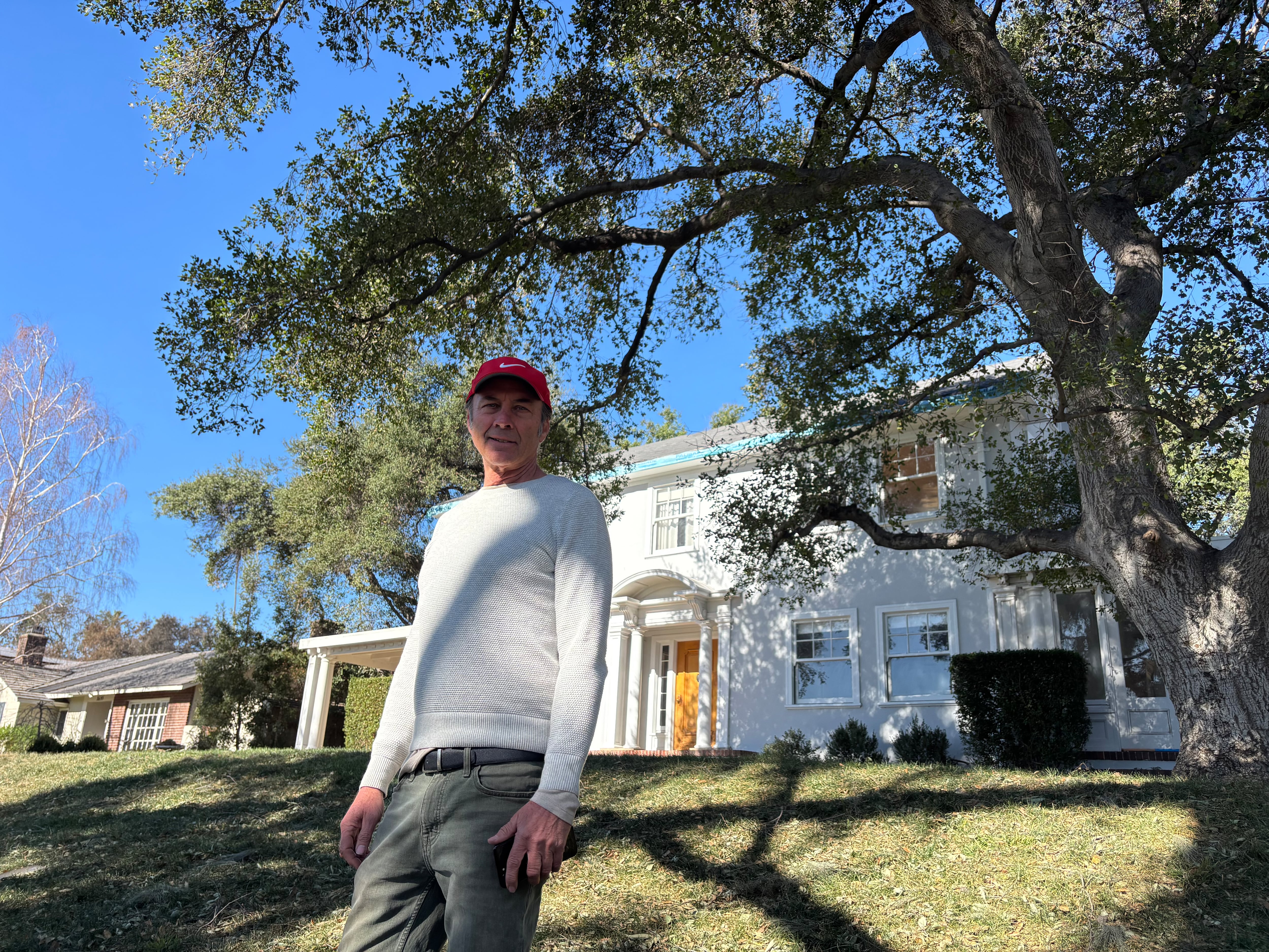 Gregory Dane in front of his home in Altadena, which he saved from the flames, on January 15, 2025.