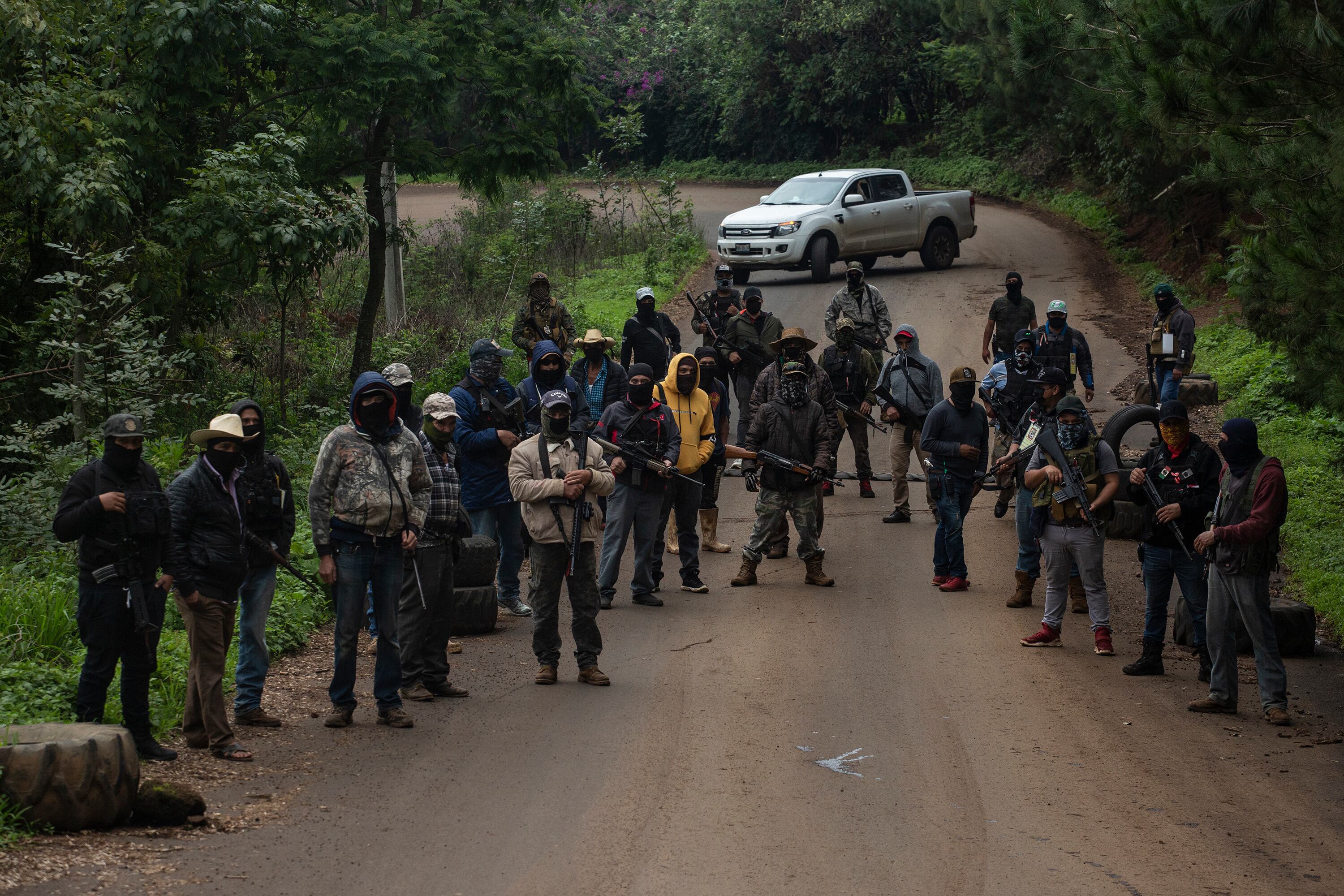 Members of a self-defense group called Pueblos Unidos set up a checkpoint in Ario de Rosales, Michoacán, in 2021.