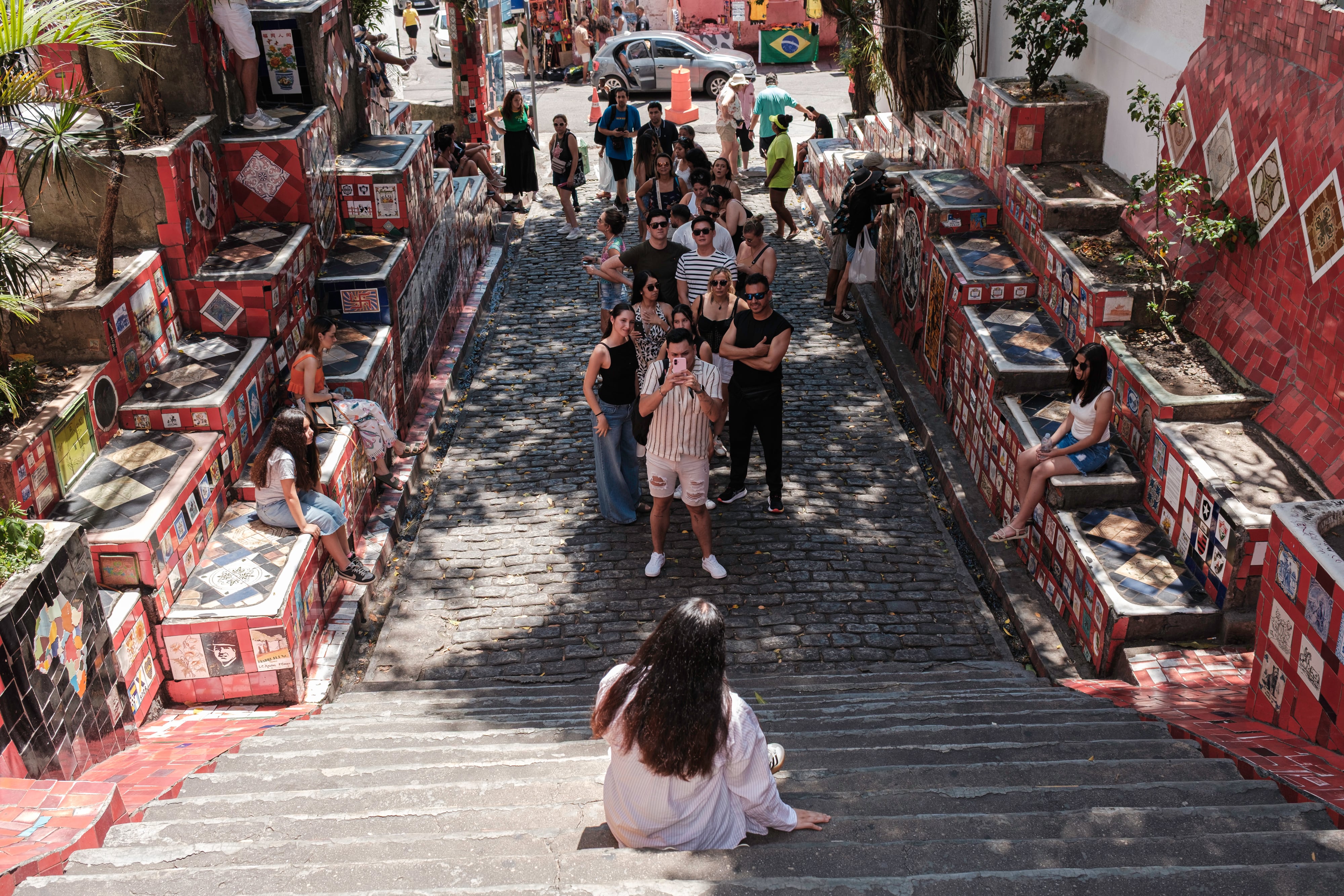 Tourists line up to take a photo at the famous Selarón Steps in Rio de Janeiro, Brazil.