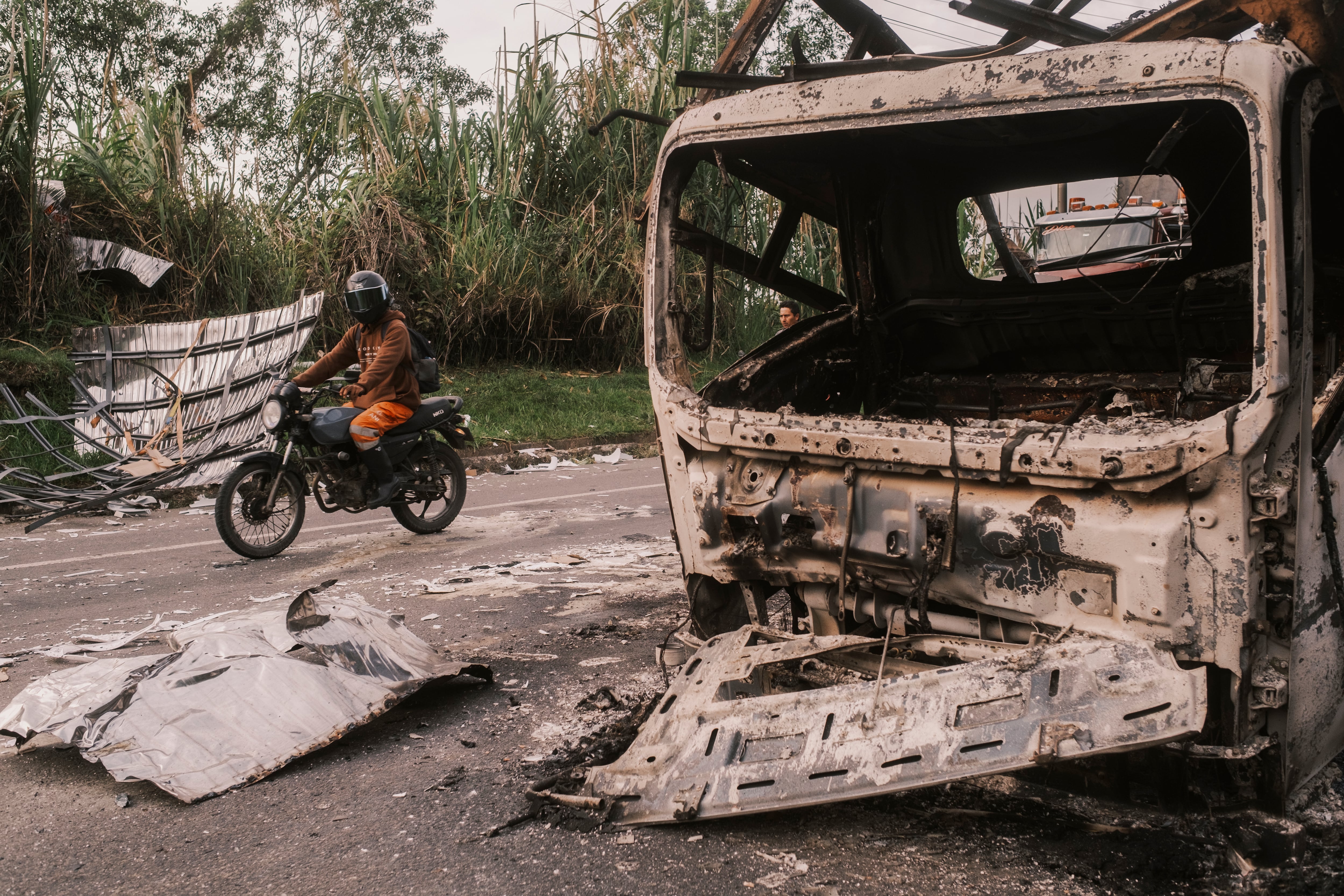 A bombed-out vehicle on the Pan-American Highway in La Agustina, Cauca, on April 29.