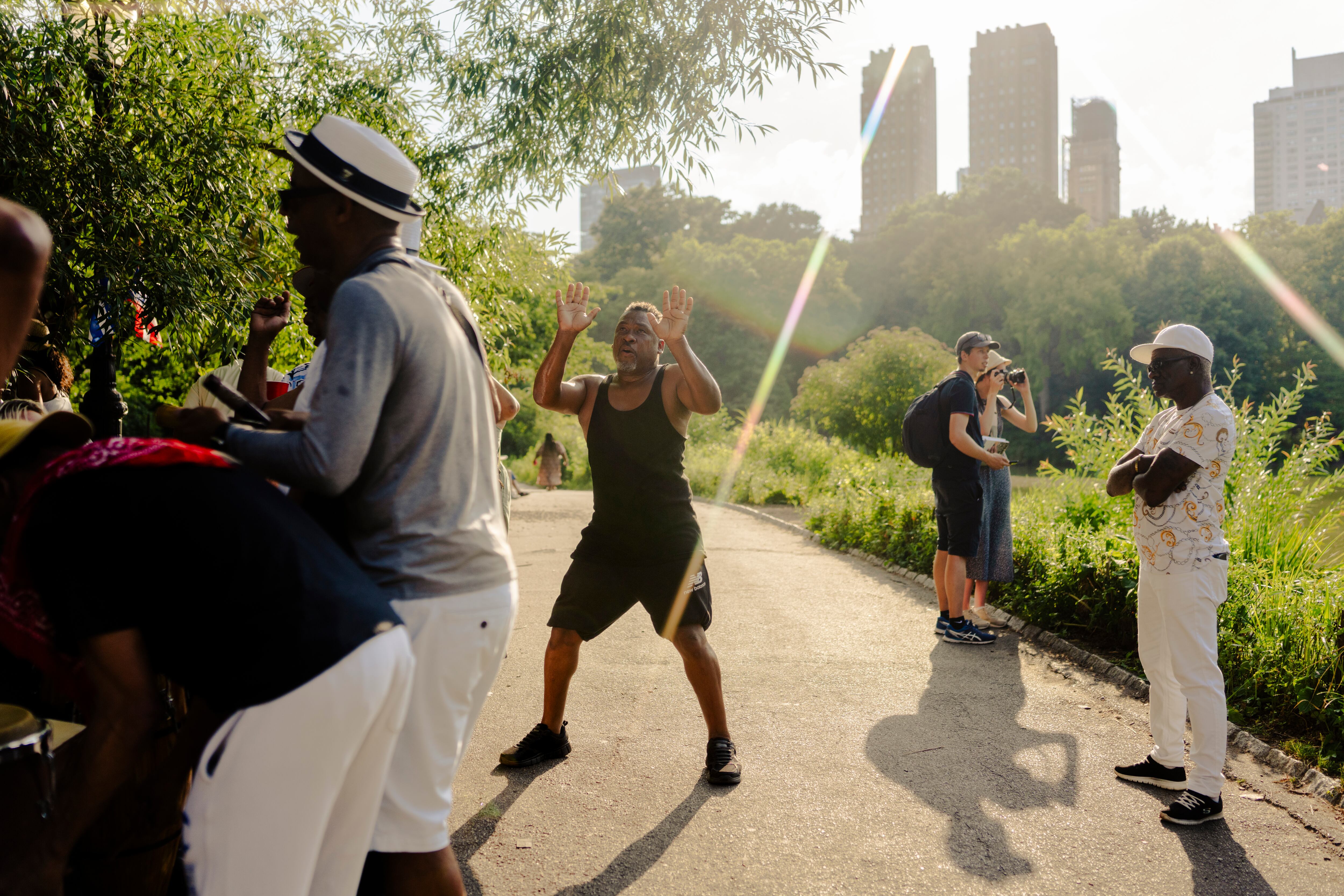 People dancing and singing rumba in Central Park.