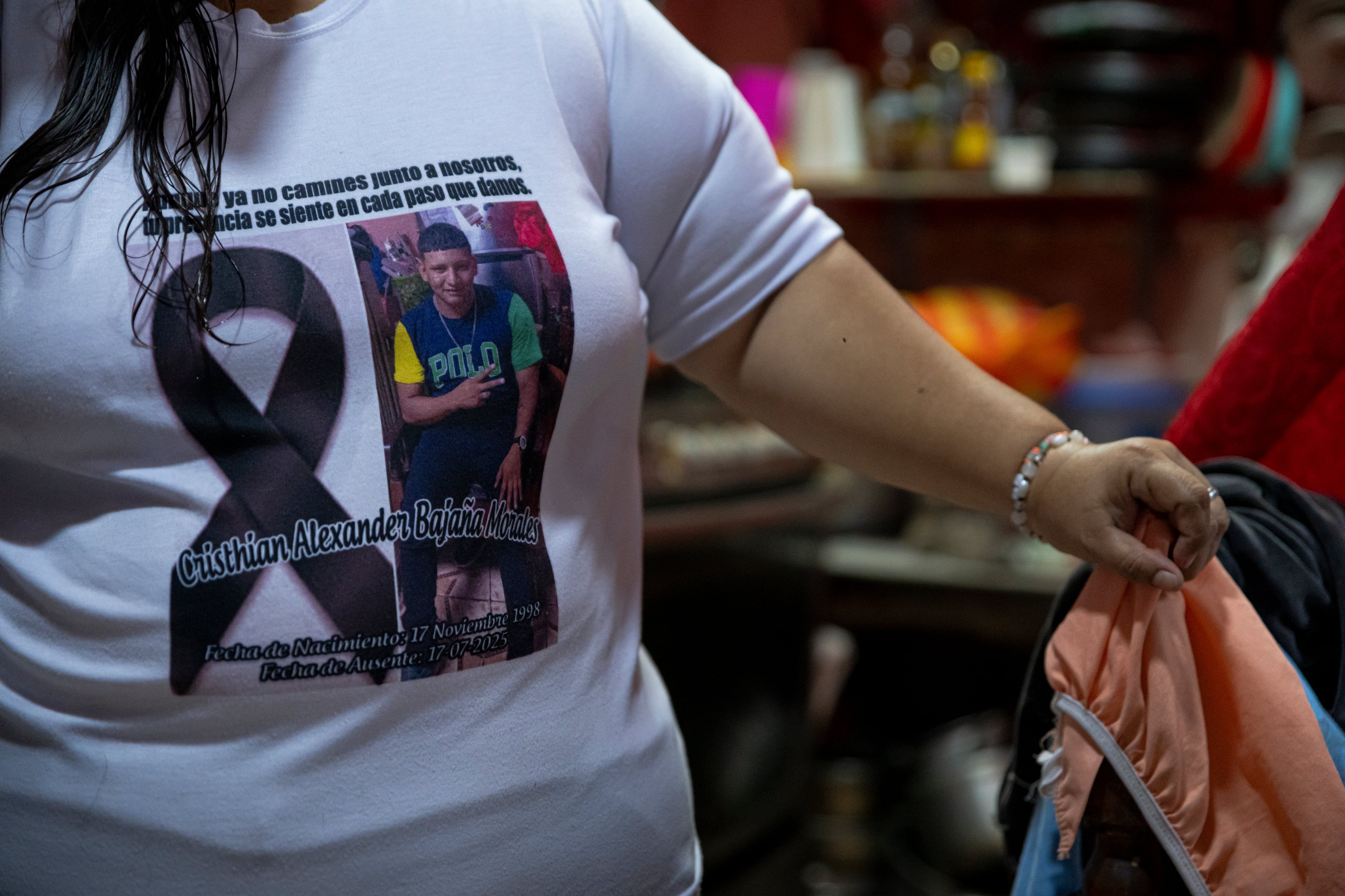Relatives wear T-shirts in memory of Andreu Ezequiel and Cristhian.