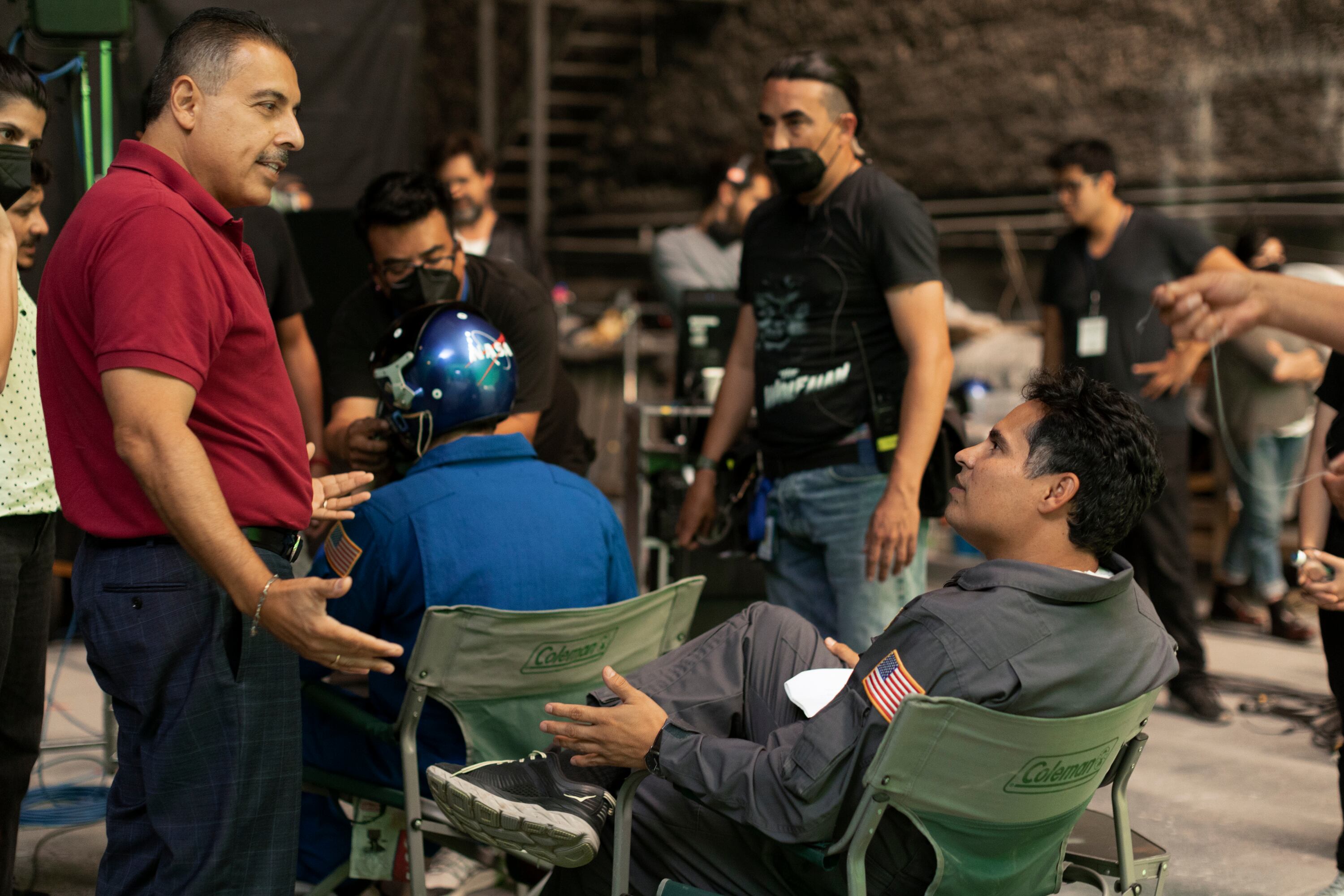 José Hernández (left) and actor Michael Peña (seated) on the set of 'A Million Miles Away'