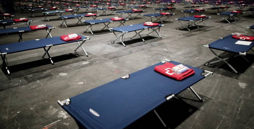 A temporary homeless shelter has been created at the Ifema trade fair facility in Madrid. 