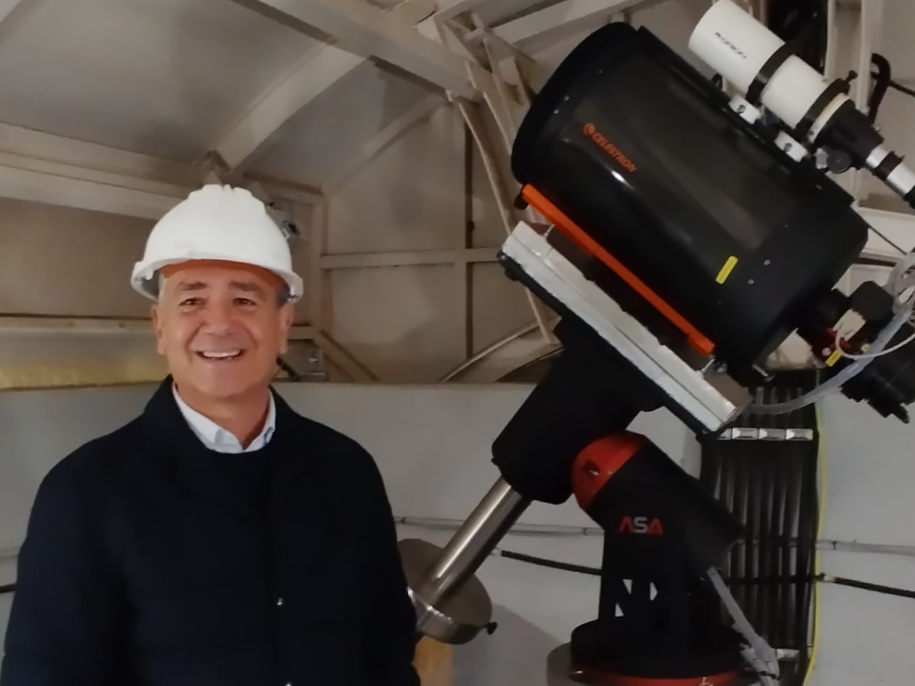 Astrophysicist Rafael Guzmán poses with a replica of Arrakihs in the Javalambre observatory, in Teruel, Spain.