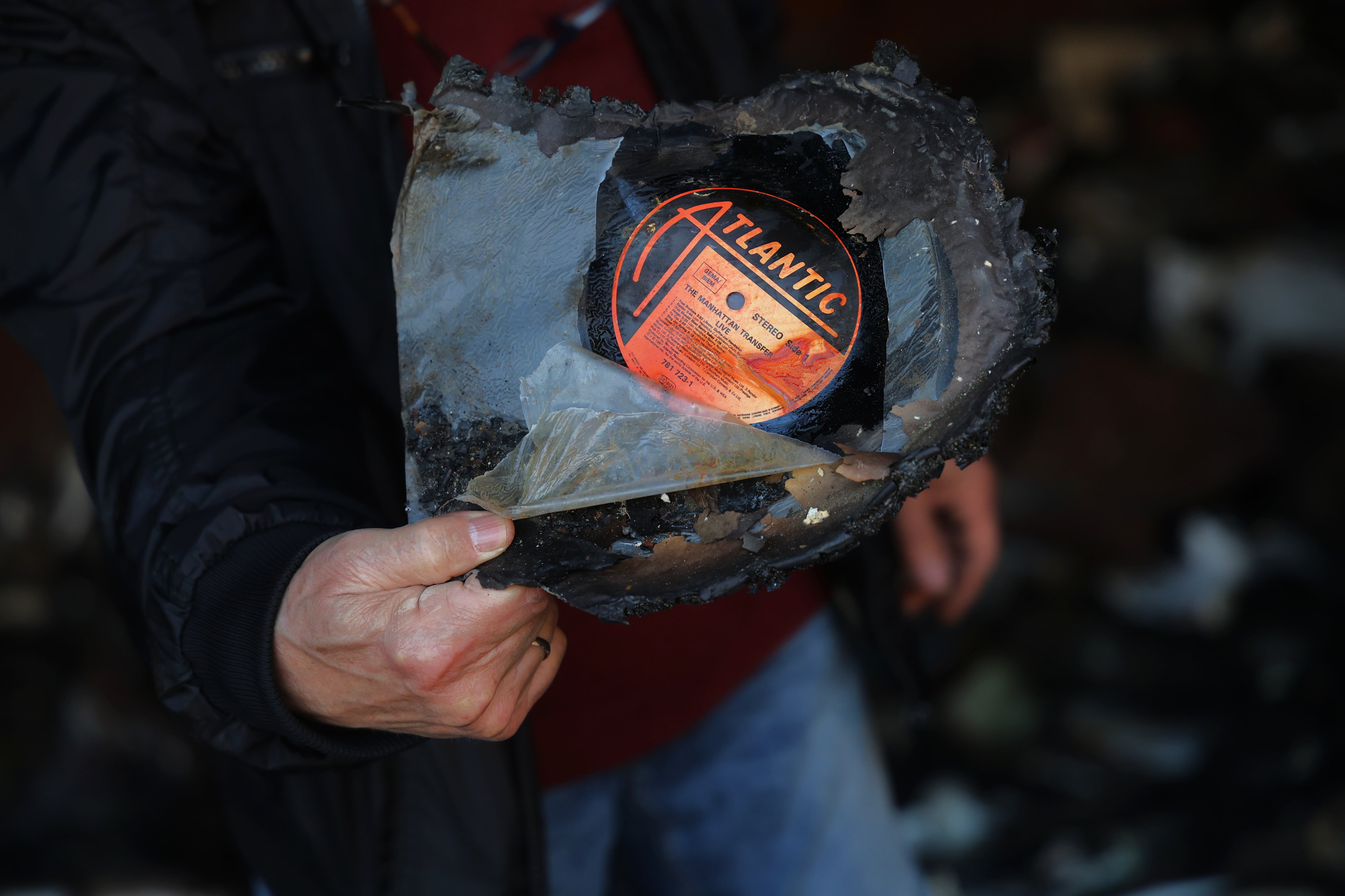 Vadym Glynarskyy with a Manhattan Transfer album he salvaged from the remains of his collection.