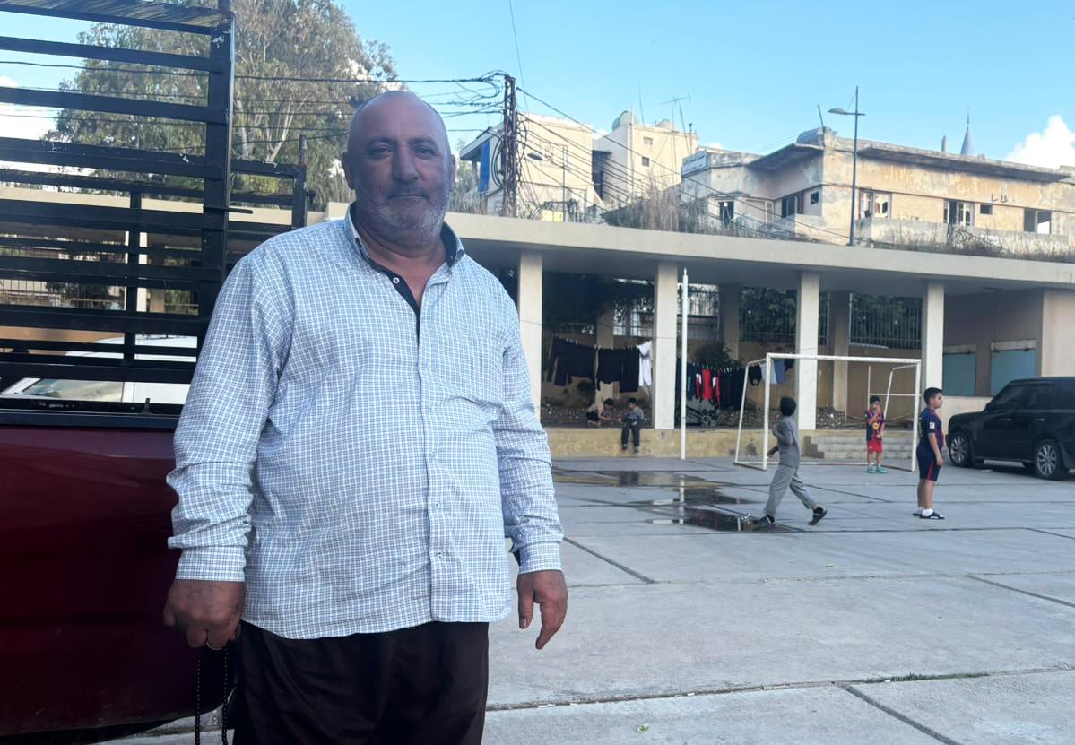 Haidar Rasheed Said poses at the civil defense shelter where he has been forcibly displaced in Tyre, April 20.