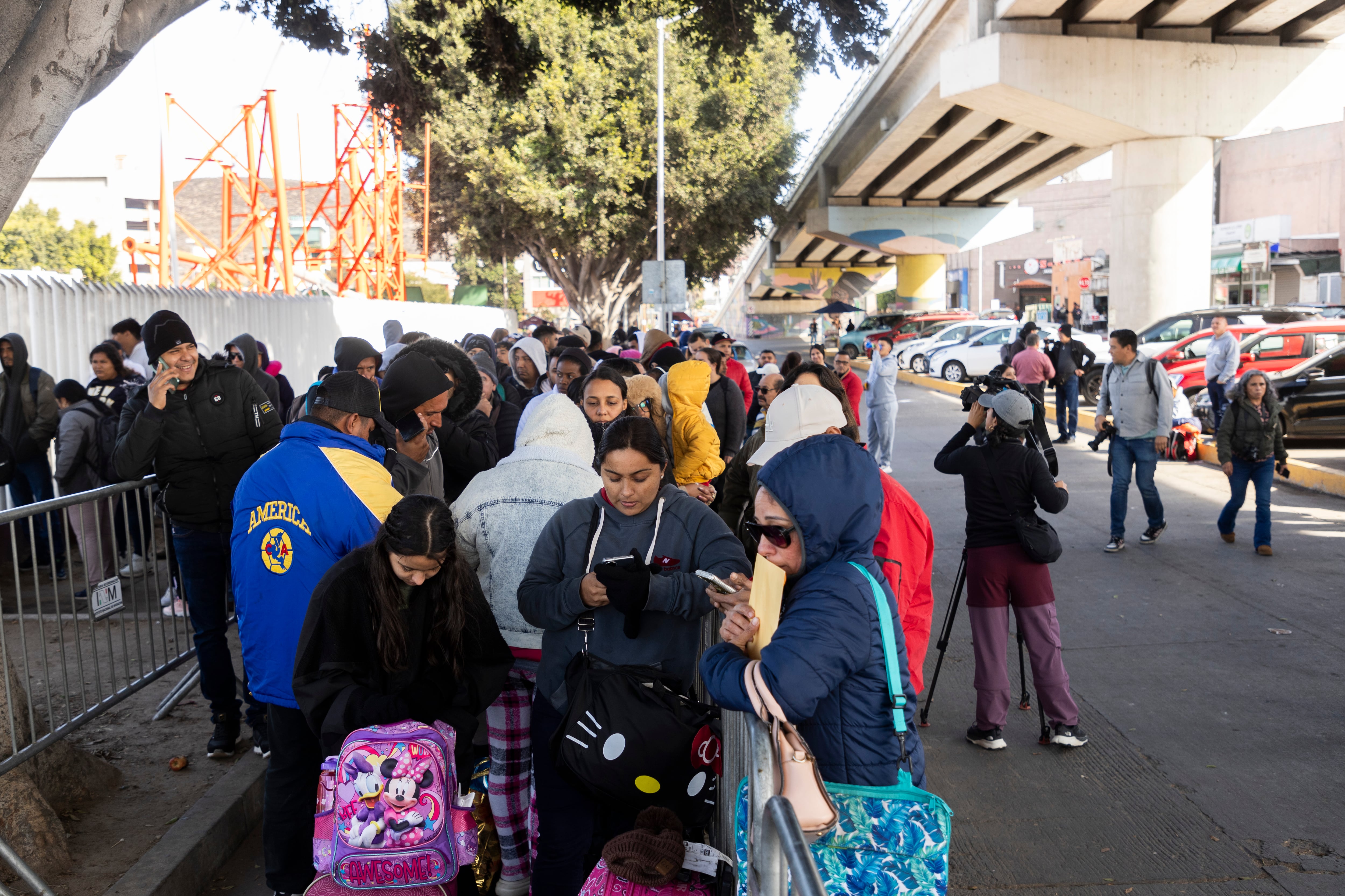 Hundreds of migrants wait in El Chaparral, in Tijuana.