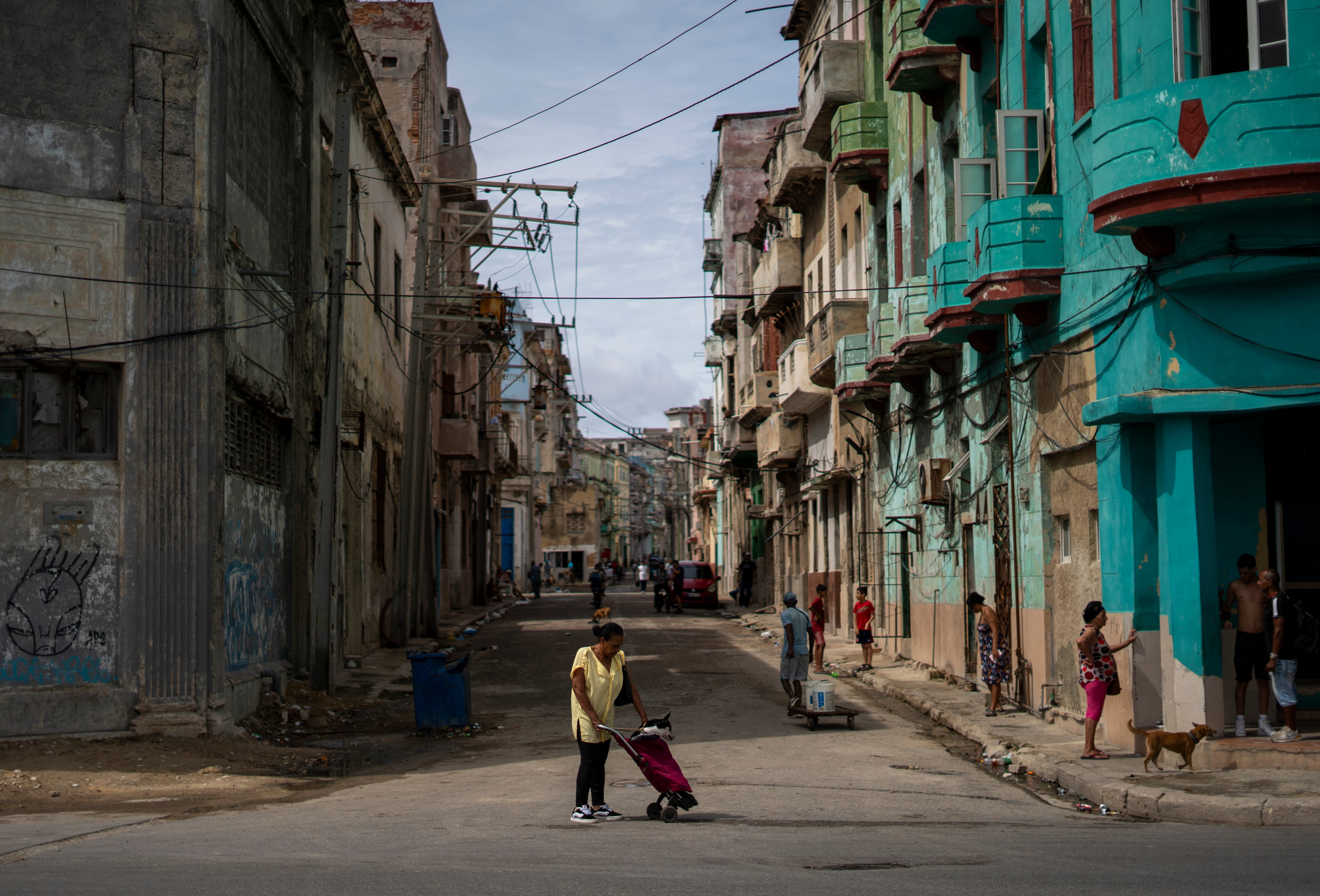 A woman walks through the streets of Havana, Cuba, on March 17.