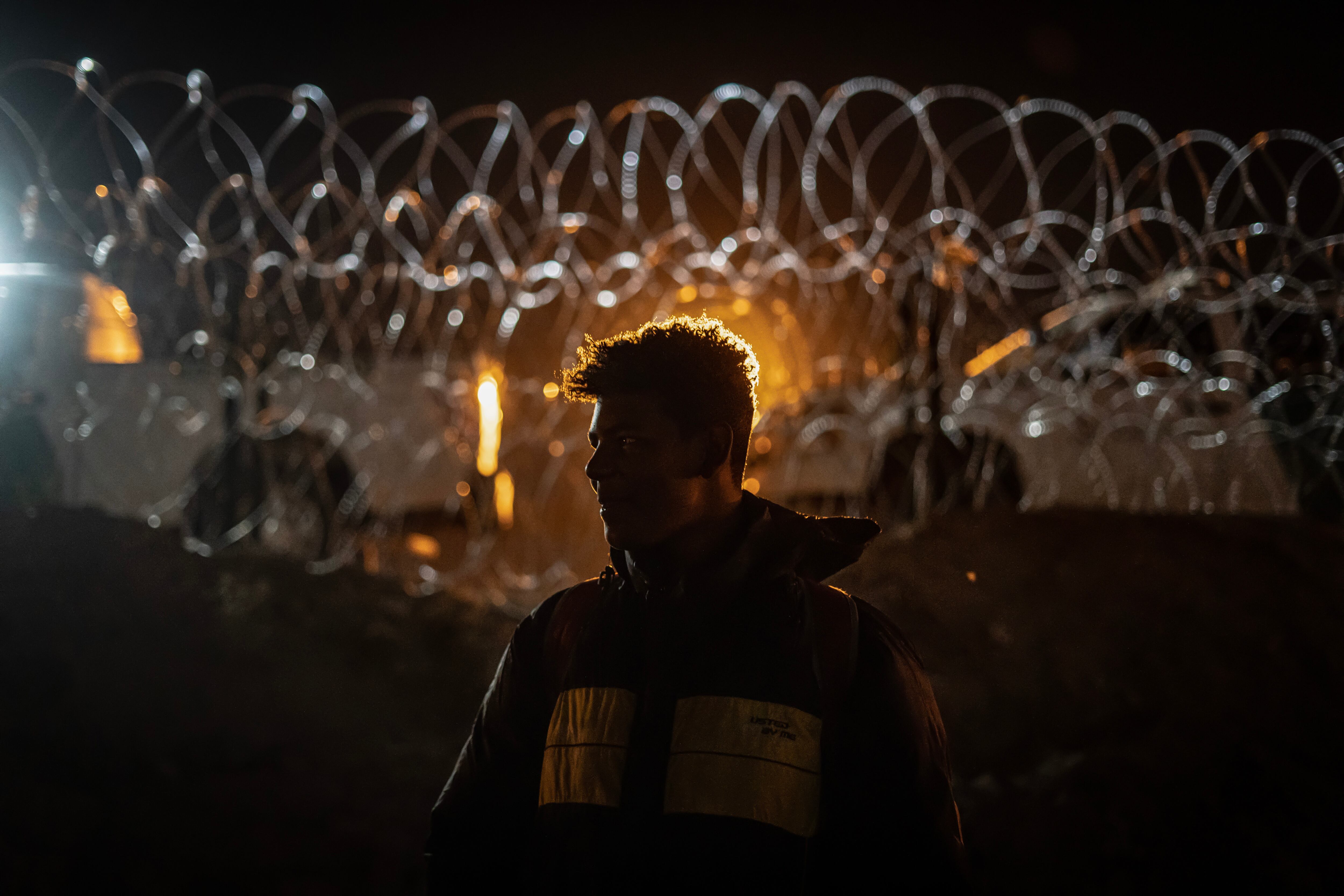 A migrant from Venezuela waits between El Paso and Ciudad Juarez, hoping to apply for humanitarian asylum in the U.S, on May 12, 2023.