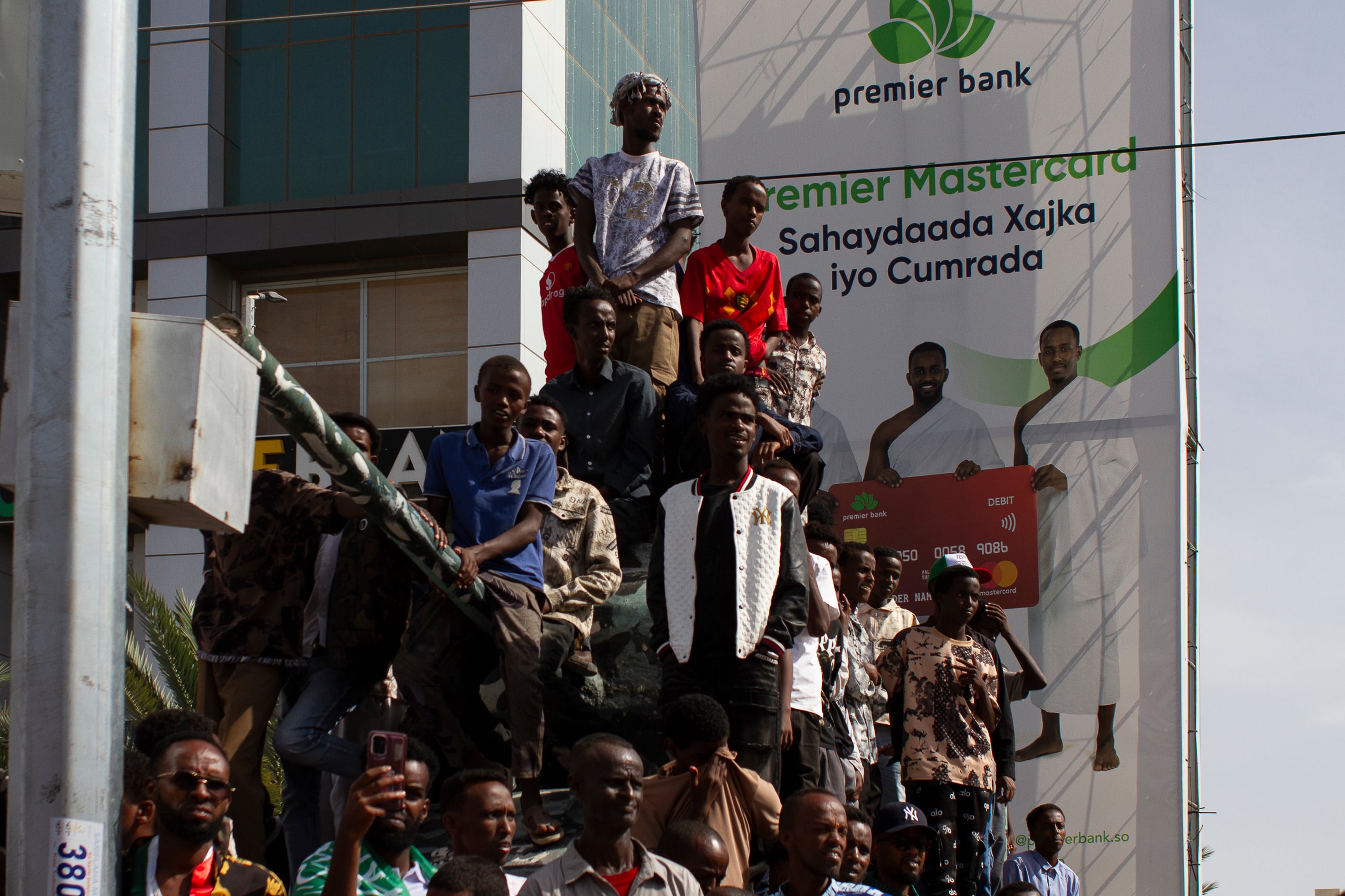 A group of young Somalilanders, perched atop a fake tank, watch the May 18 military parade in Hargeisa.