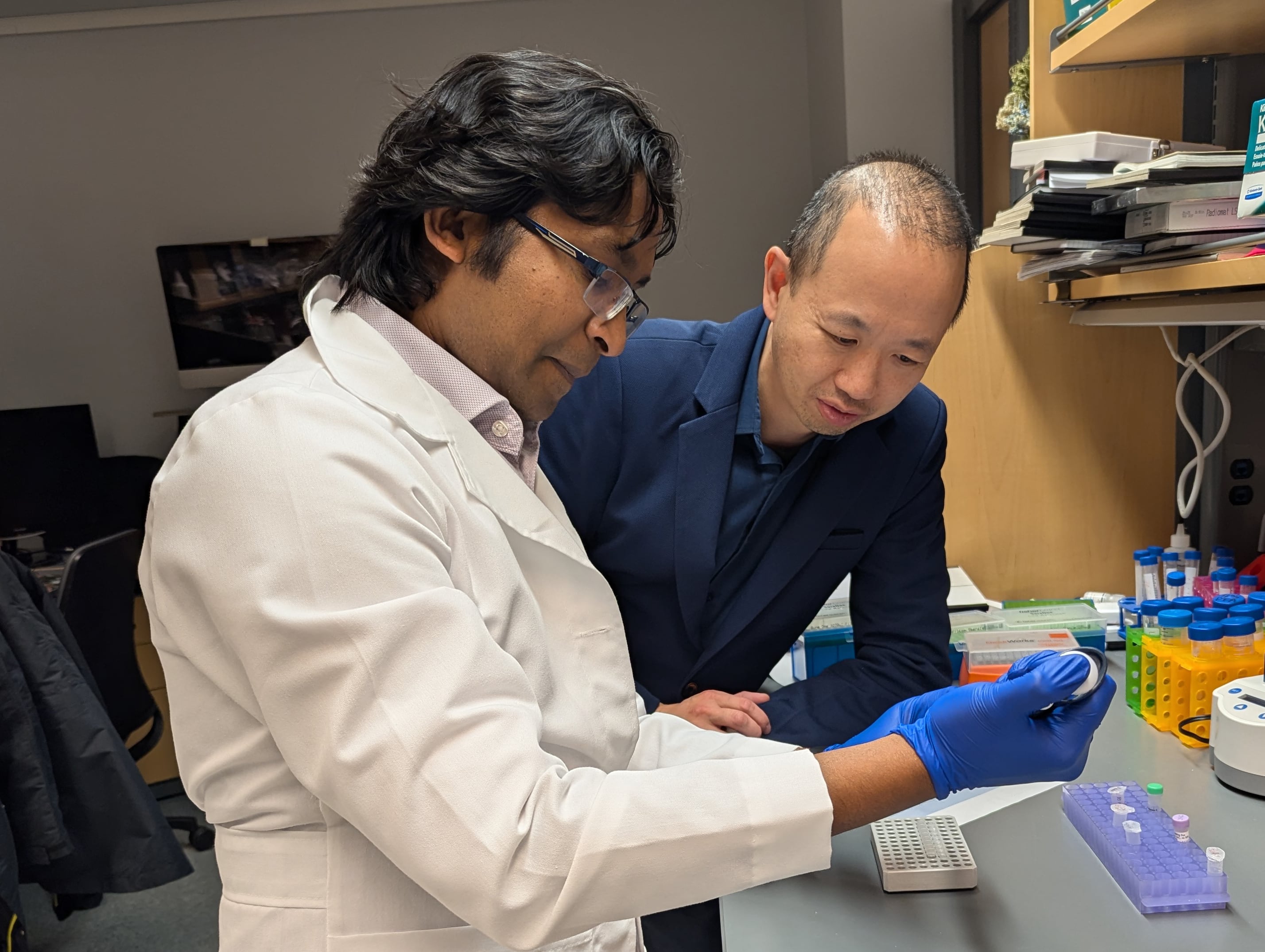 Biologist Ken Lau, right, co-author of the study on pre-cancerous lesions.