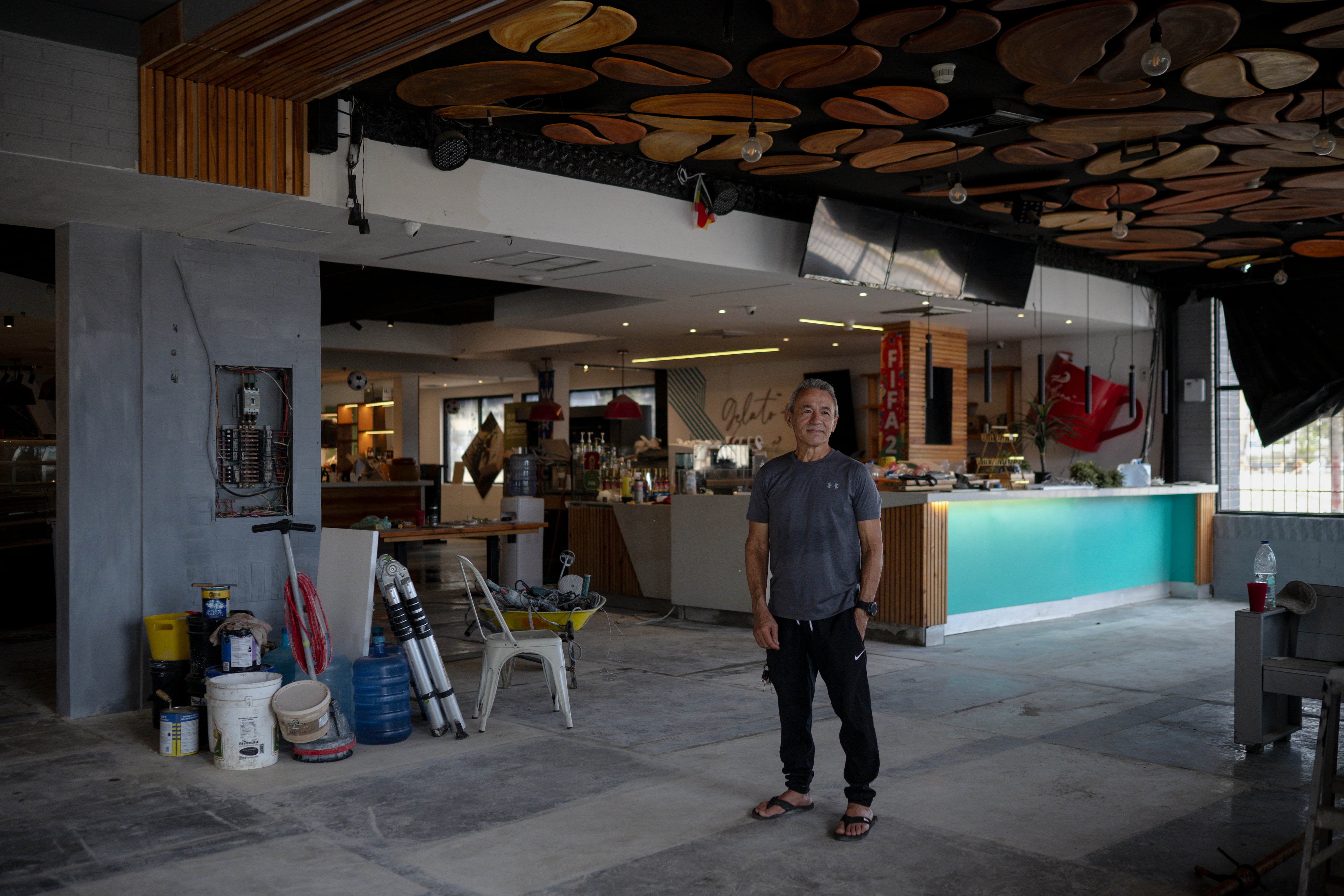 Carlos Franco, owner of Café Alejandrina, inside his business in La Guaira.