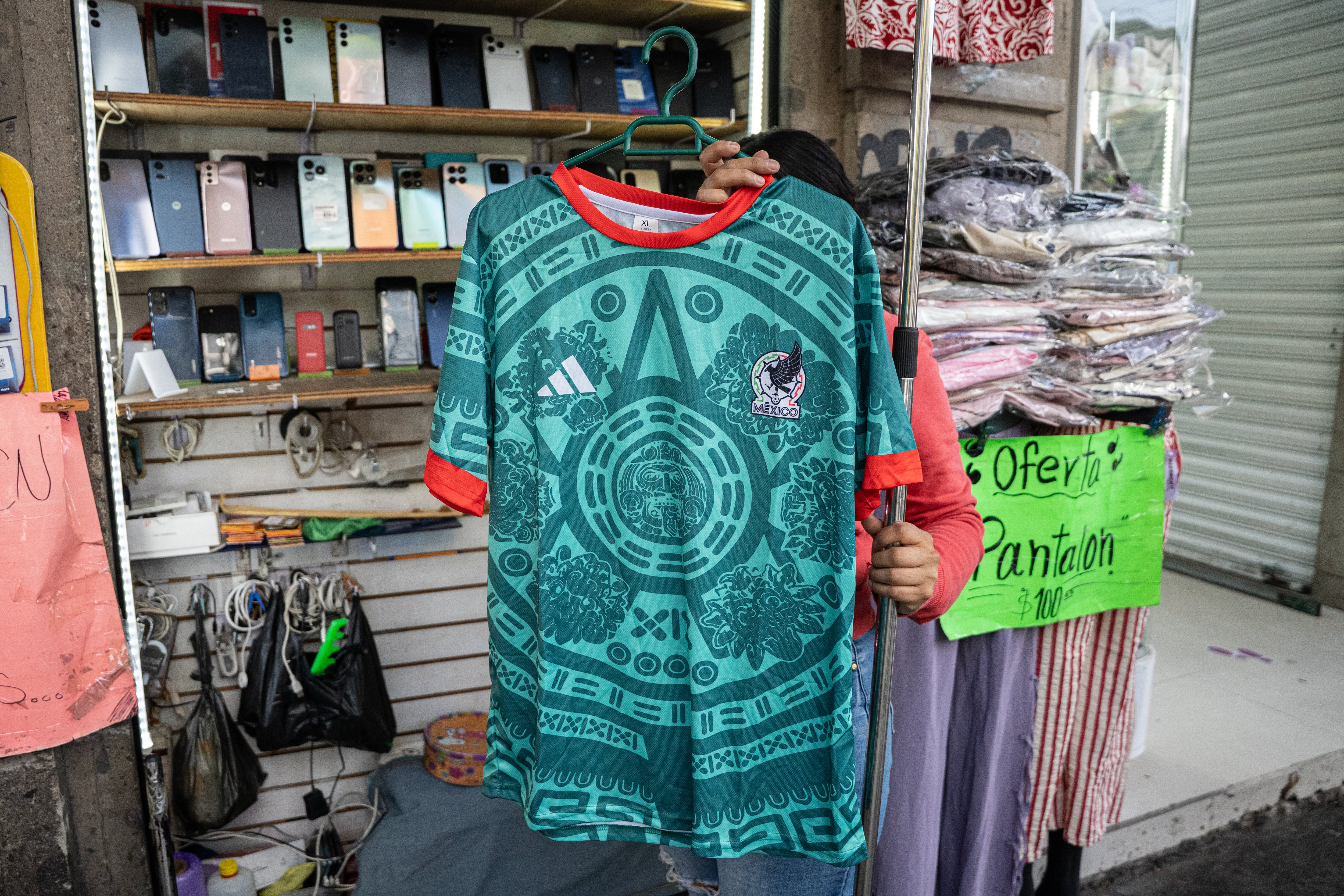 A vendor displays a Mexican national team jersey in Mexico City.