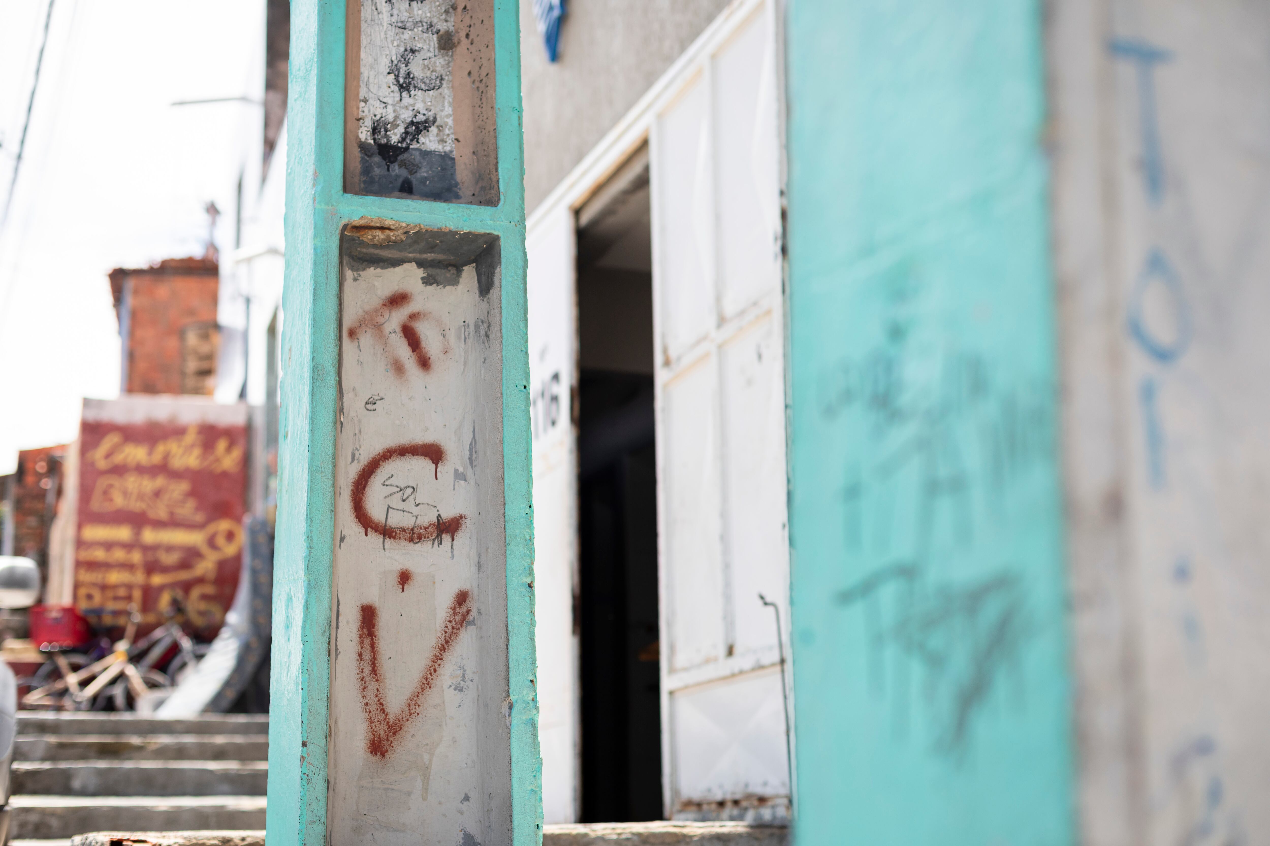 Comando Vermelho, the criminal group that controls drug sales in Moura Brasil, leaves its mark and imposes its dominance on the favela's residents.