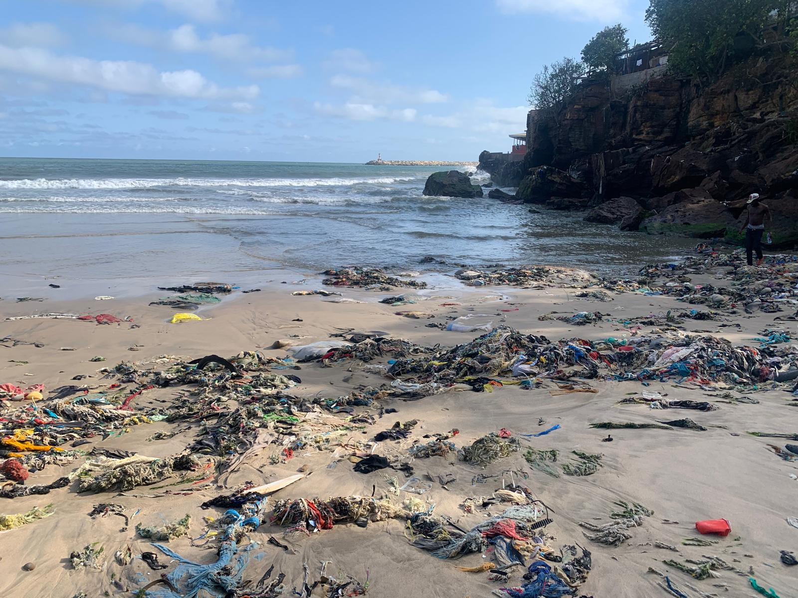 Akuma Village, an Accra beach, covered in the remains of used clothing in October.