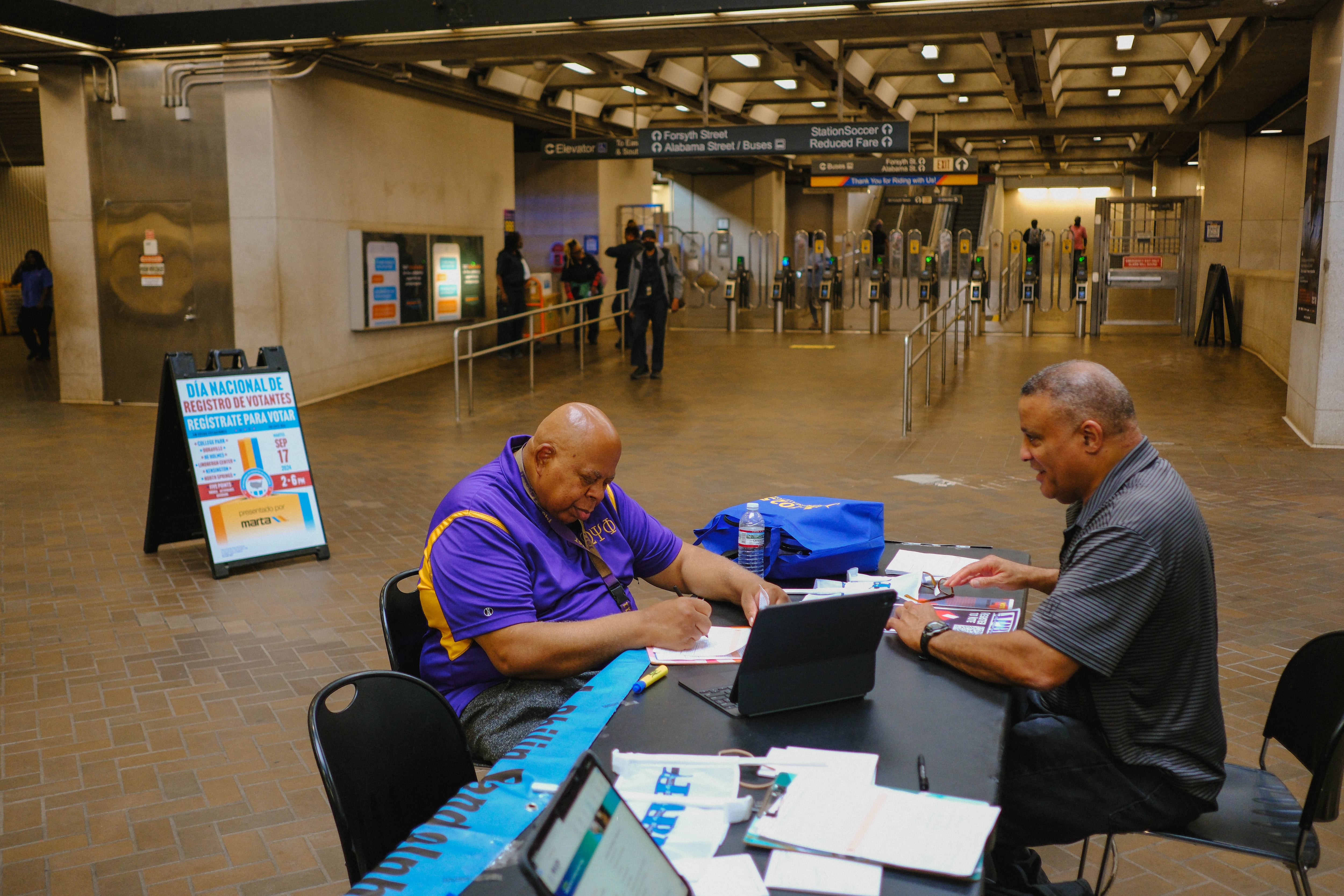 A man registers to vote in Atlanta on September 17, 2024.