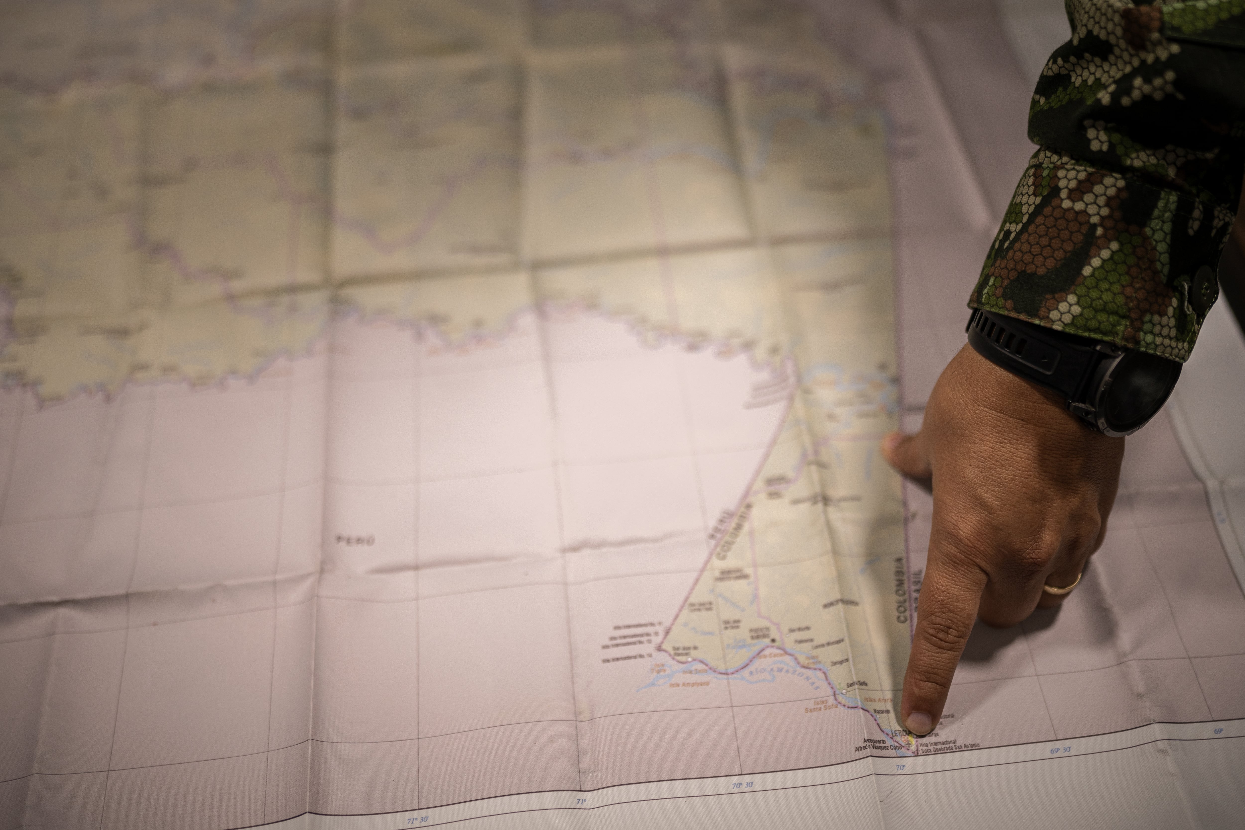 Brigadier General Cortés points to the map of Leticia.