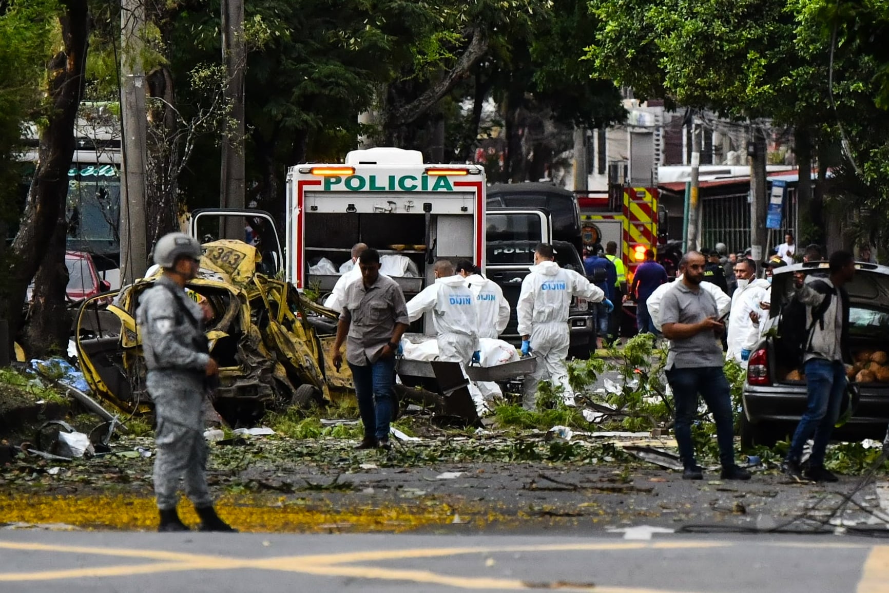 Agents recover a body at the scene of an attack in northern Cali on August 21, 2025.