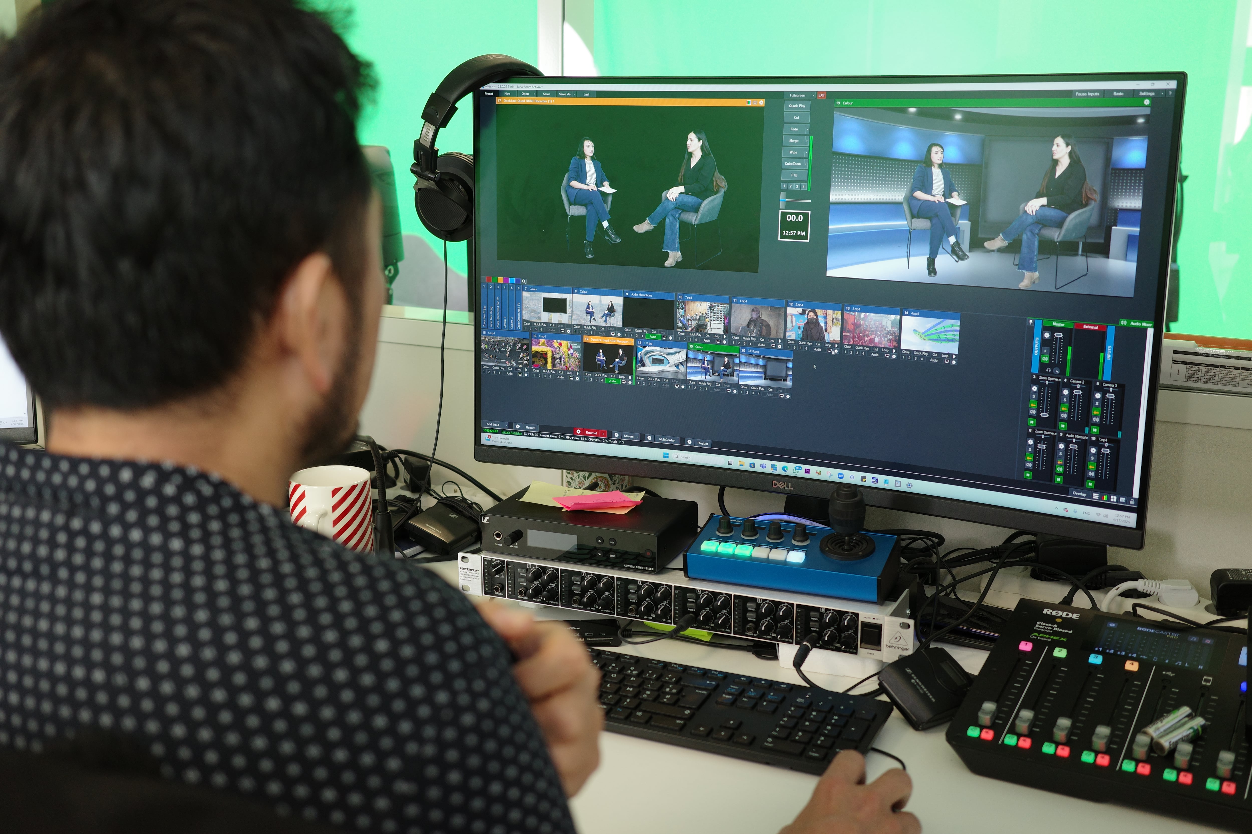Ziauddin Bakhtyar, an Afghan journalist refugee in France, works on a Begum TV broadcast on April 17.