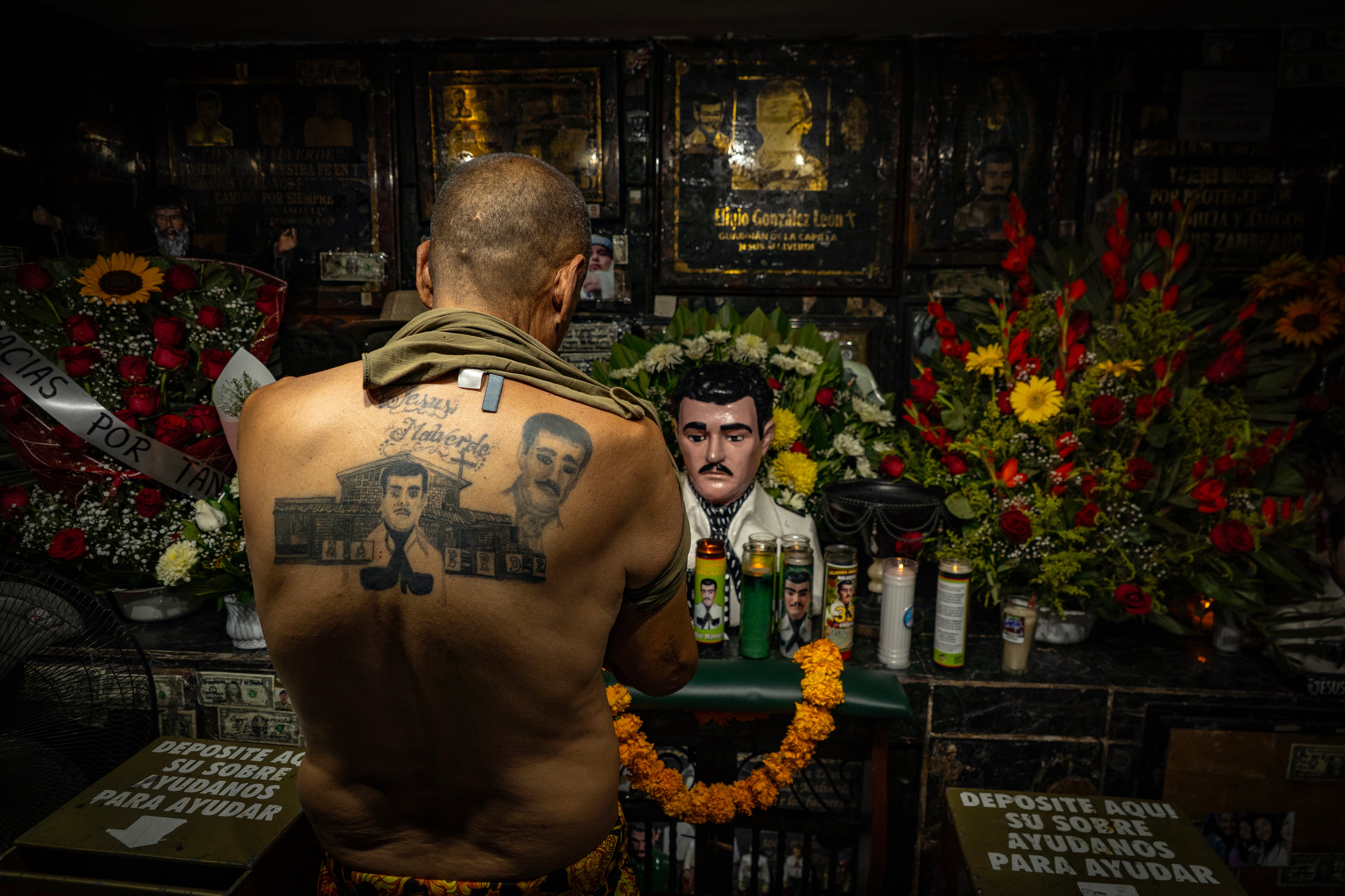 A man prays in the Malverde Chapel in Culiacán.