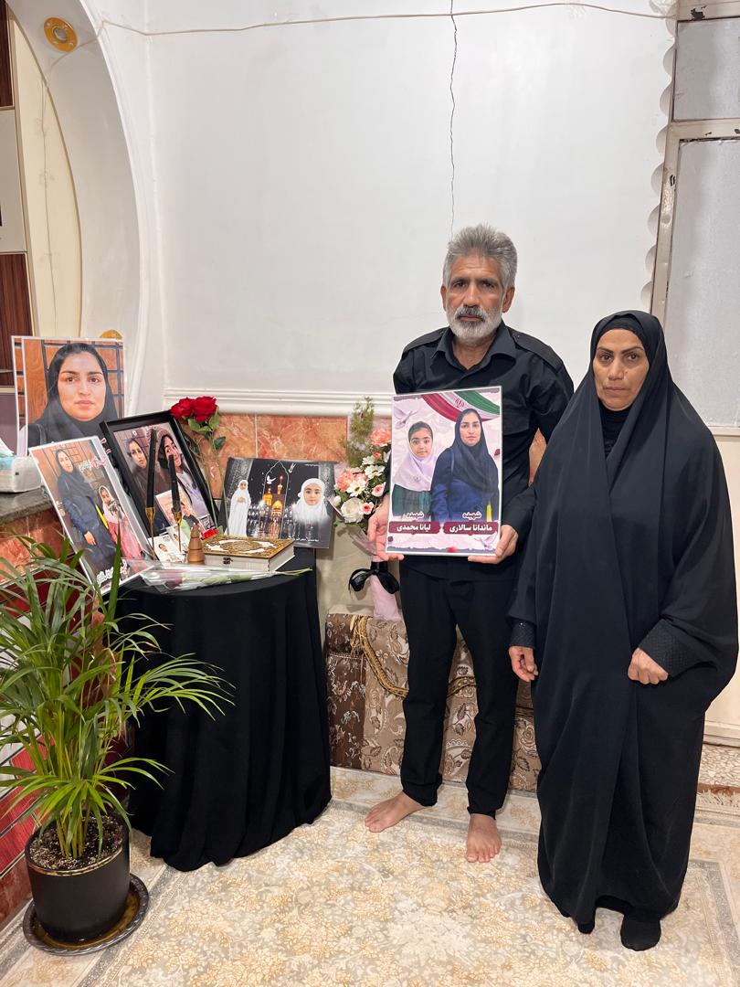Mandana Salari's parents, in front of the makeshift altar at home dedicated to their daughter and granddaughter, Liana, in a photo from Wednesday, May 13.