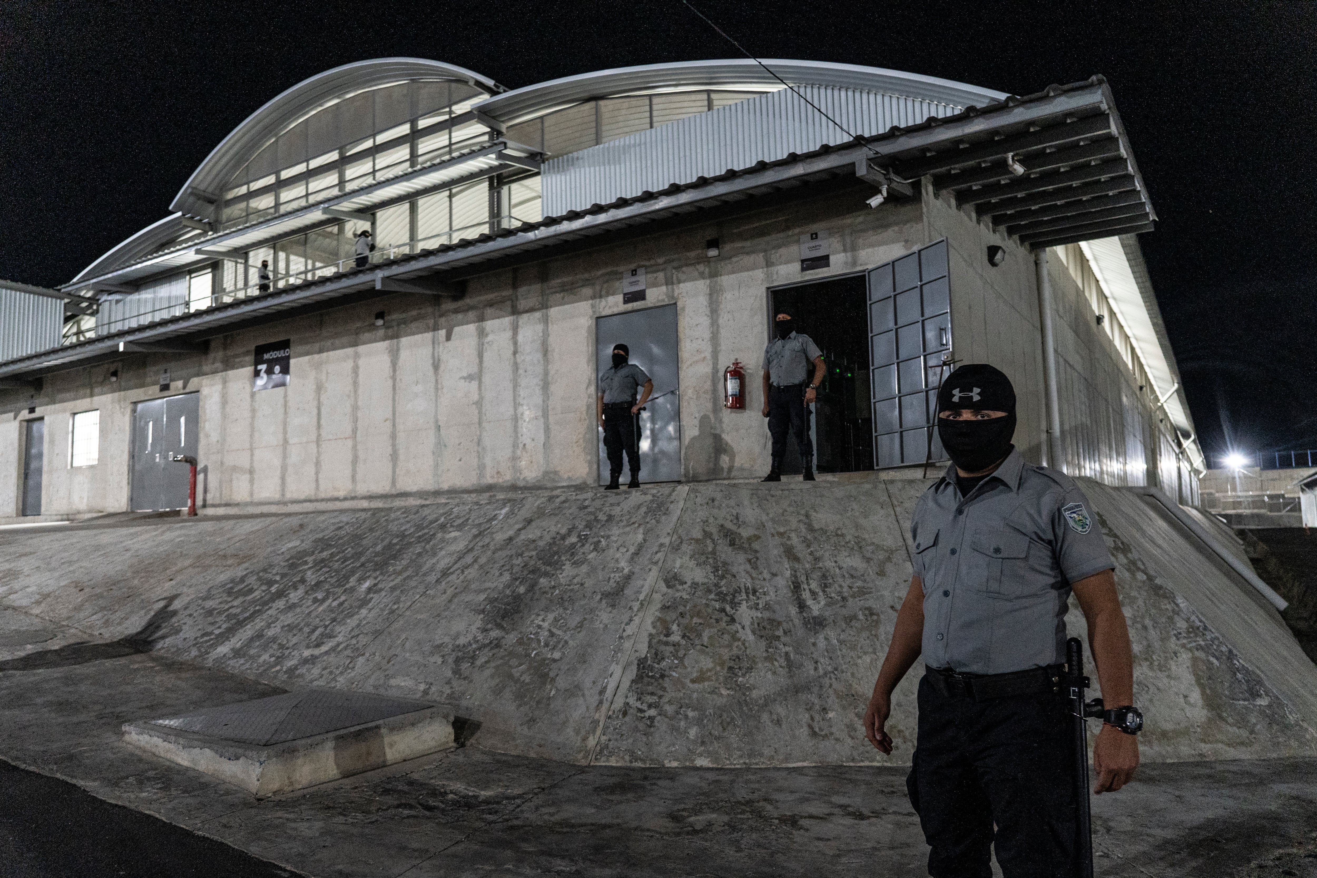 Officers guard the CECOT maximum security prison in Tecoluca, El Salvador, in February 2024.