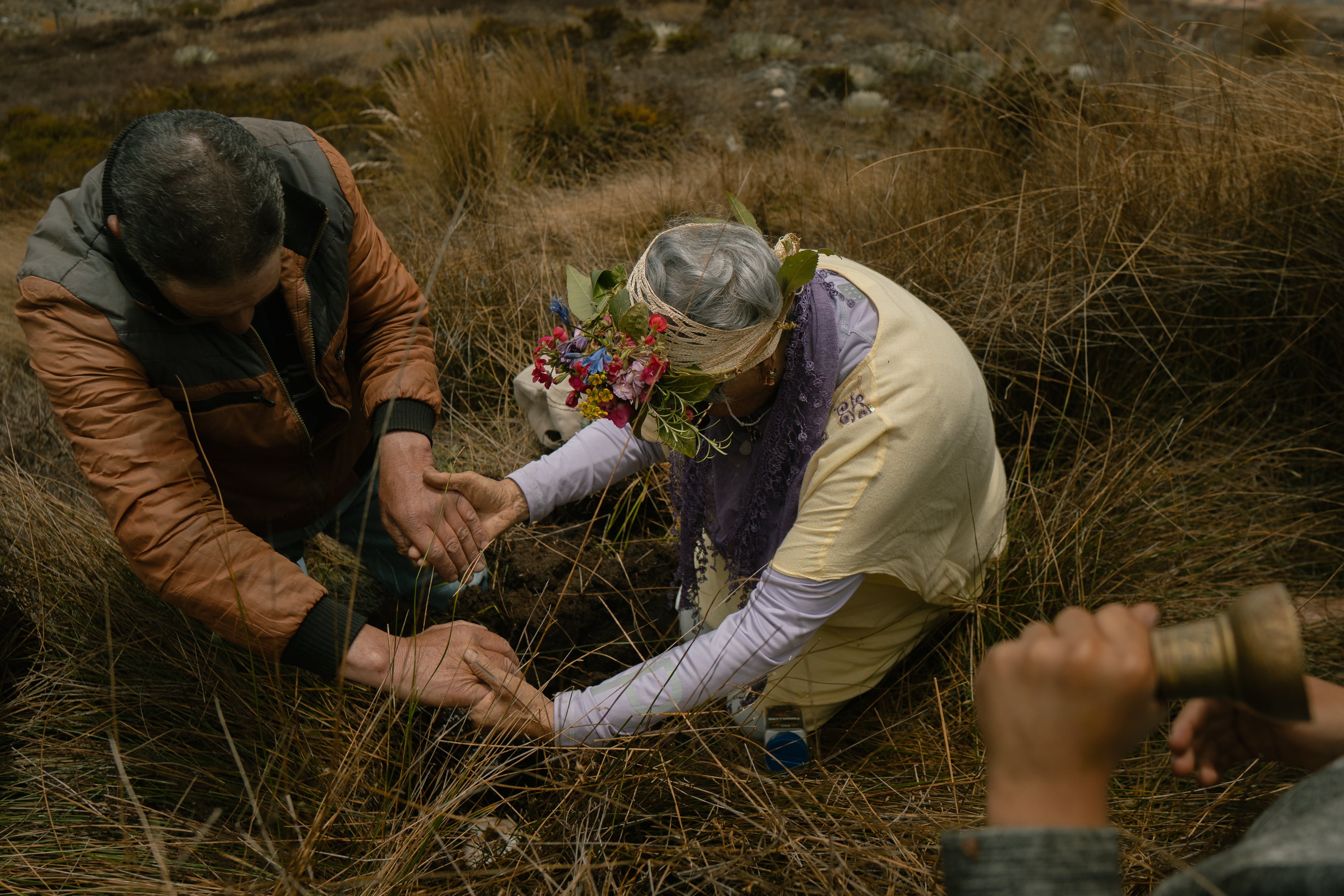 'Water sower' Ligia Parra and farmer Jorge Luis Santiago hold hands during the water sowing ceremony in Venezuela.