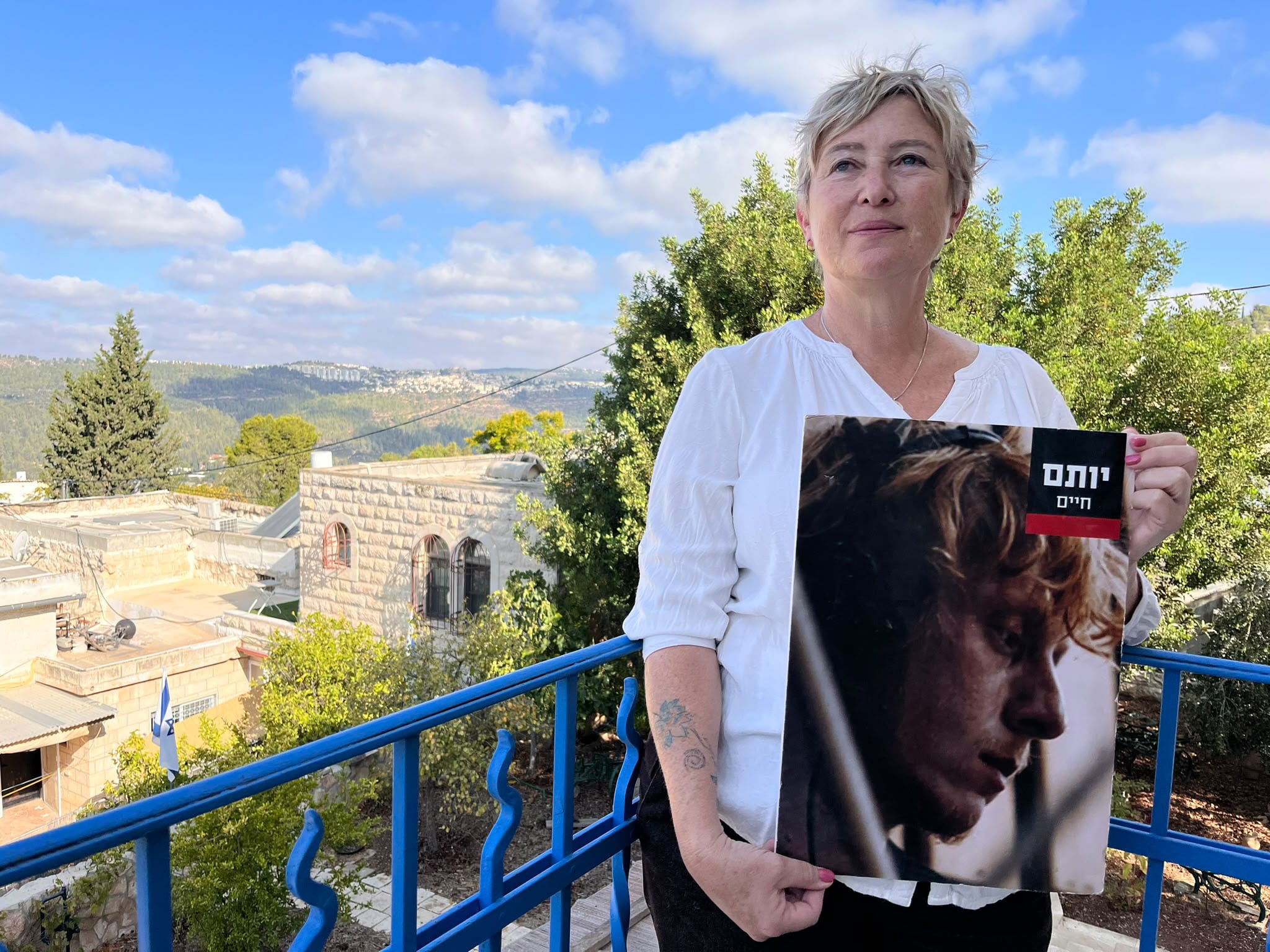 Iris Haim, with a photo of her late son Yotam, at her home in Ein Karem on September 24.
