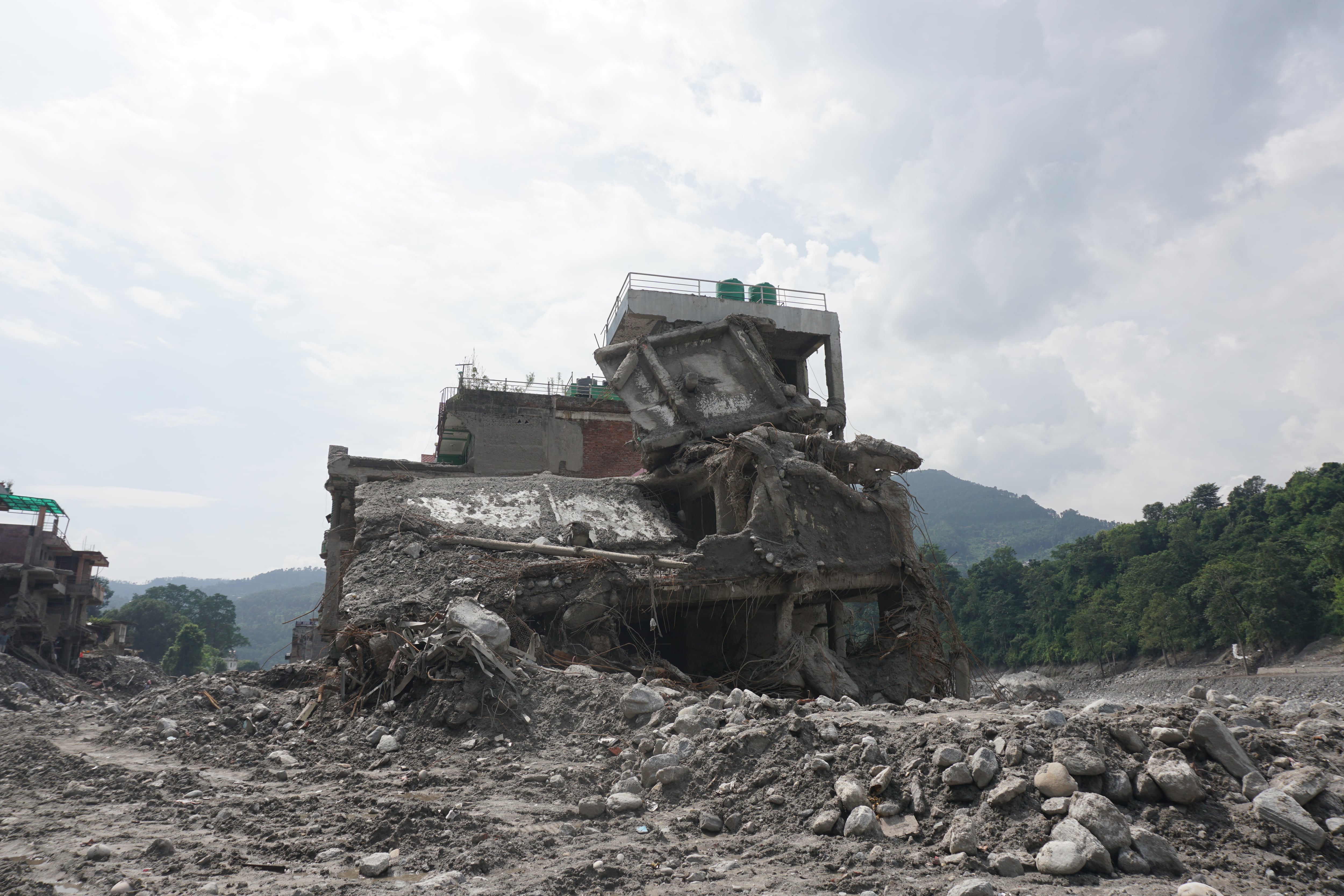A building lies partially buried under mud after the flood in Nuwakot district, Nepal, September 17.