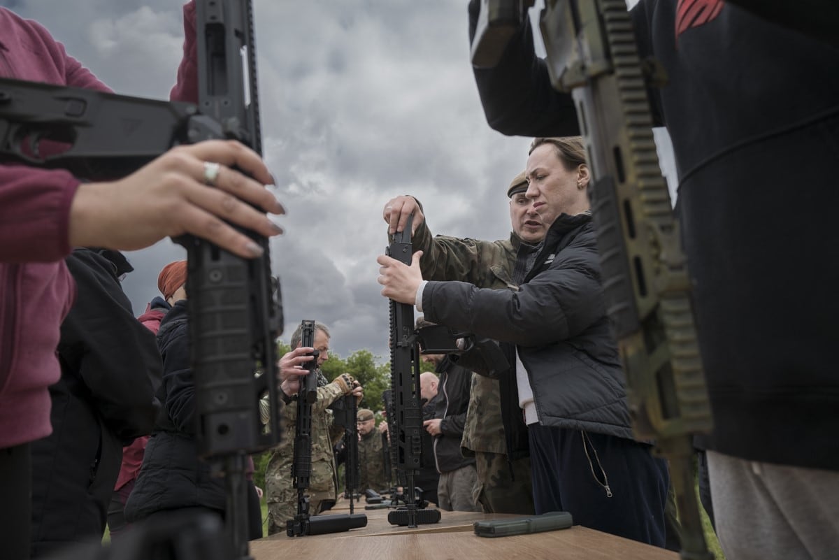 A soldier explains how to strip and assemble a Polish army Grot rifle.