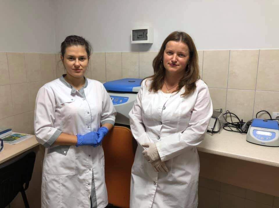  Khrystyna Shchubelka, left, with a coworker, at the location of the new DNK bank at the National University of Uzhhorod.