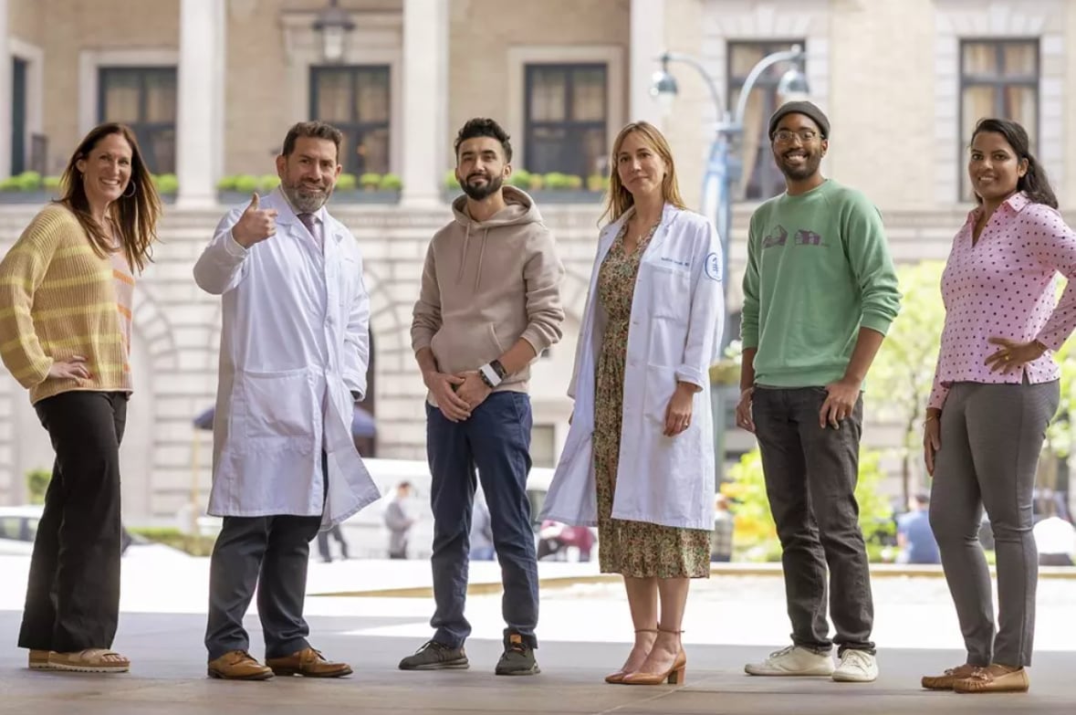 Four patients (from left, Sascha Roth, Imtiaz Hussain, Avery Holmes and Nisha Varughese) with oncologists Luis Alberto Díaz and Andrea Cercek.