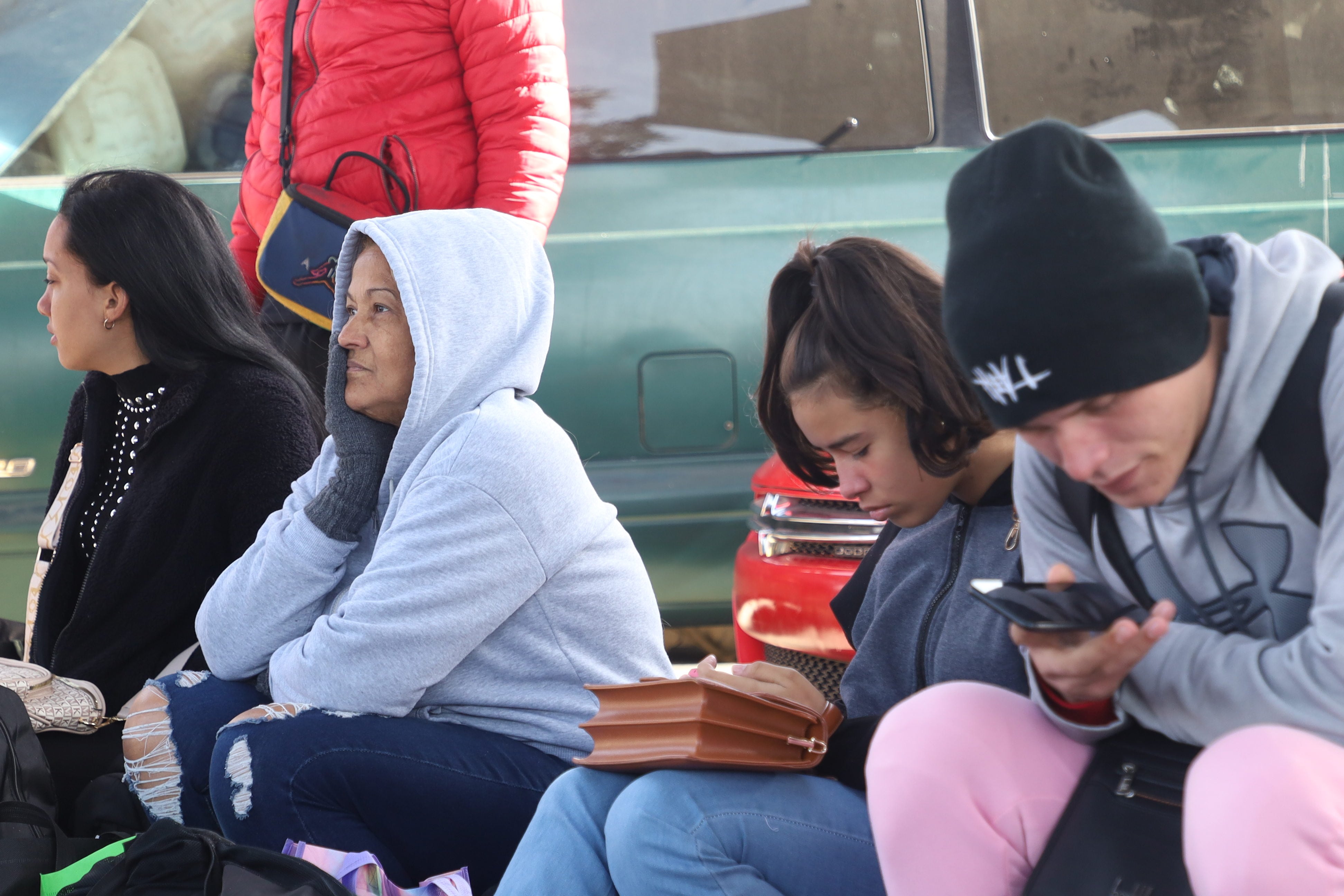 Odalys Fundicheli and her relatives on the street while waiting for information.