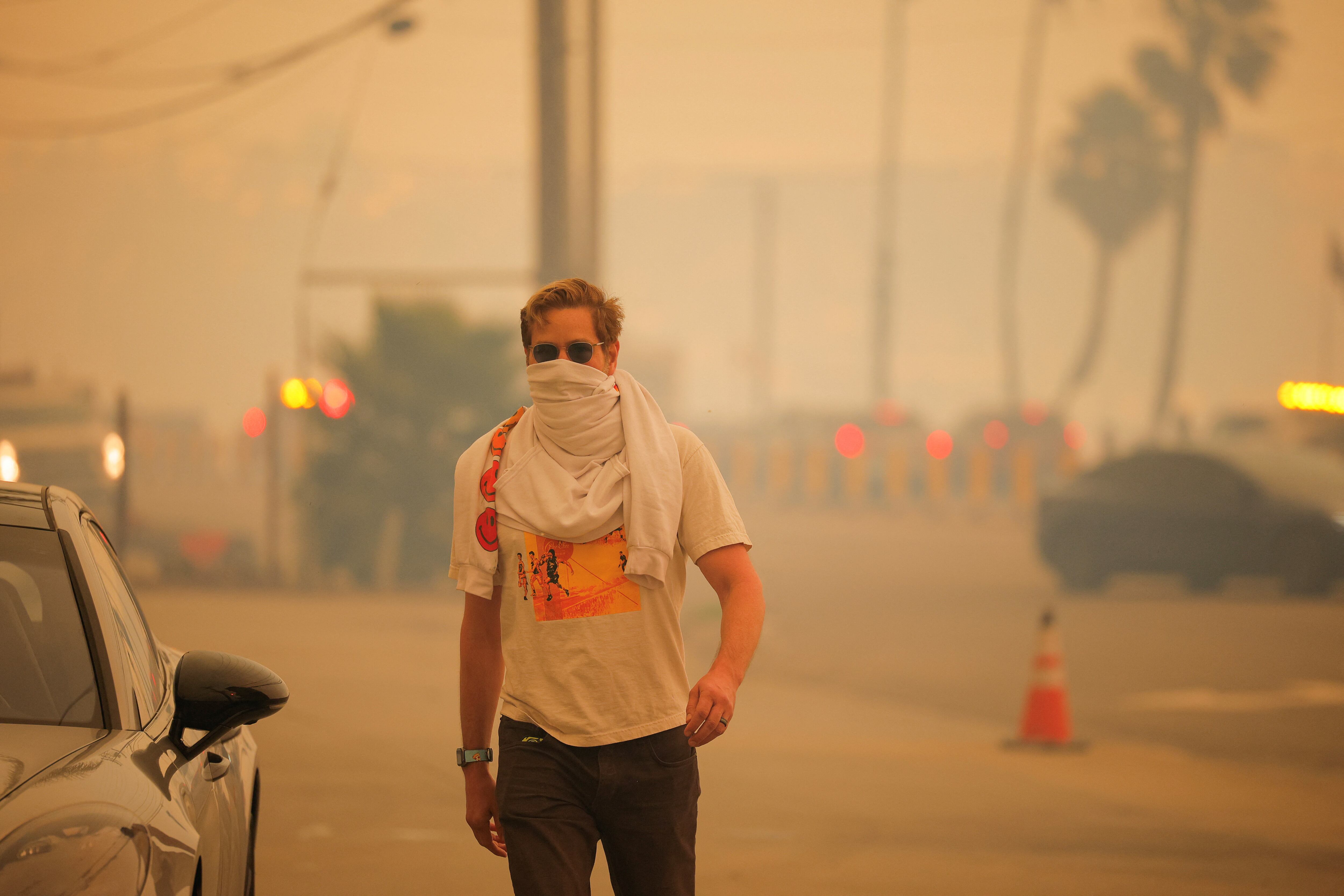 Wind-fueled fires force thousands to flee their homes in southern California