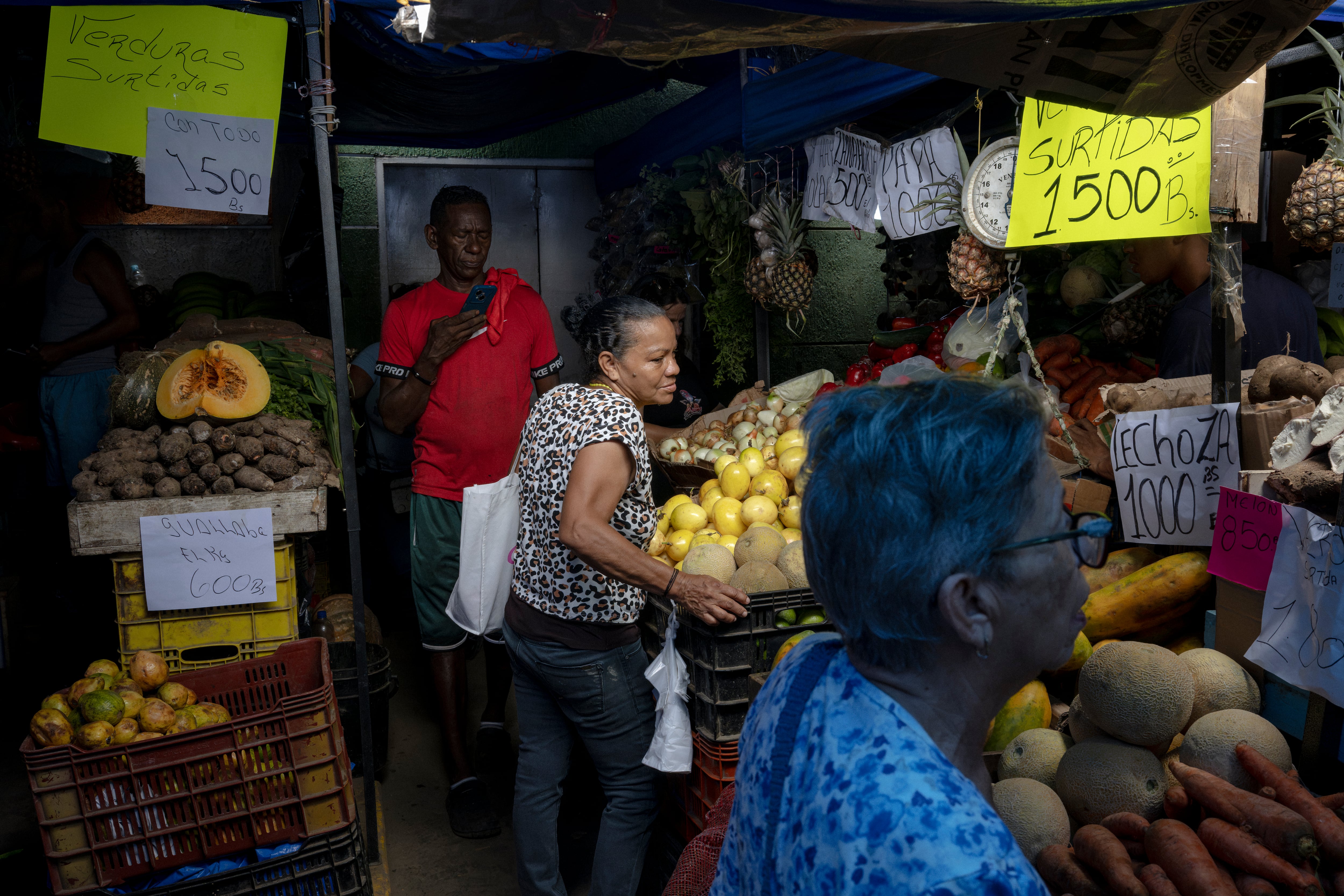 Shoppers at a temporary market set up on the outskirts of the Catia La Mar Community Market.
