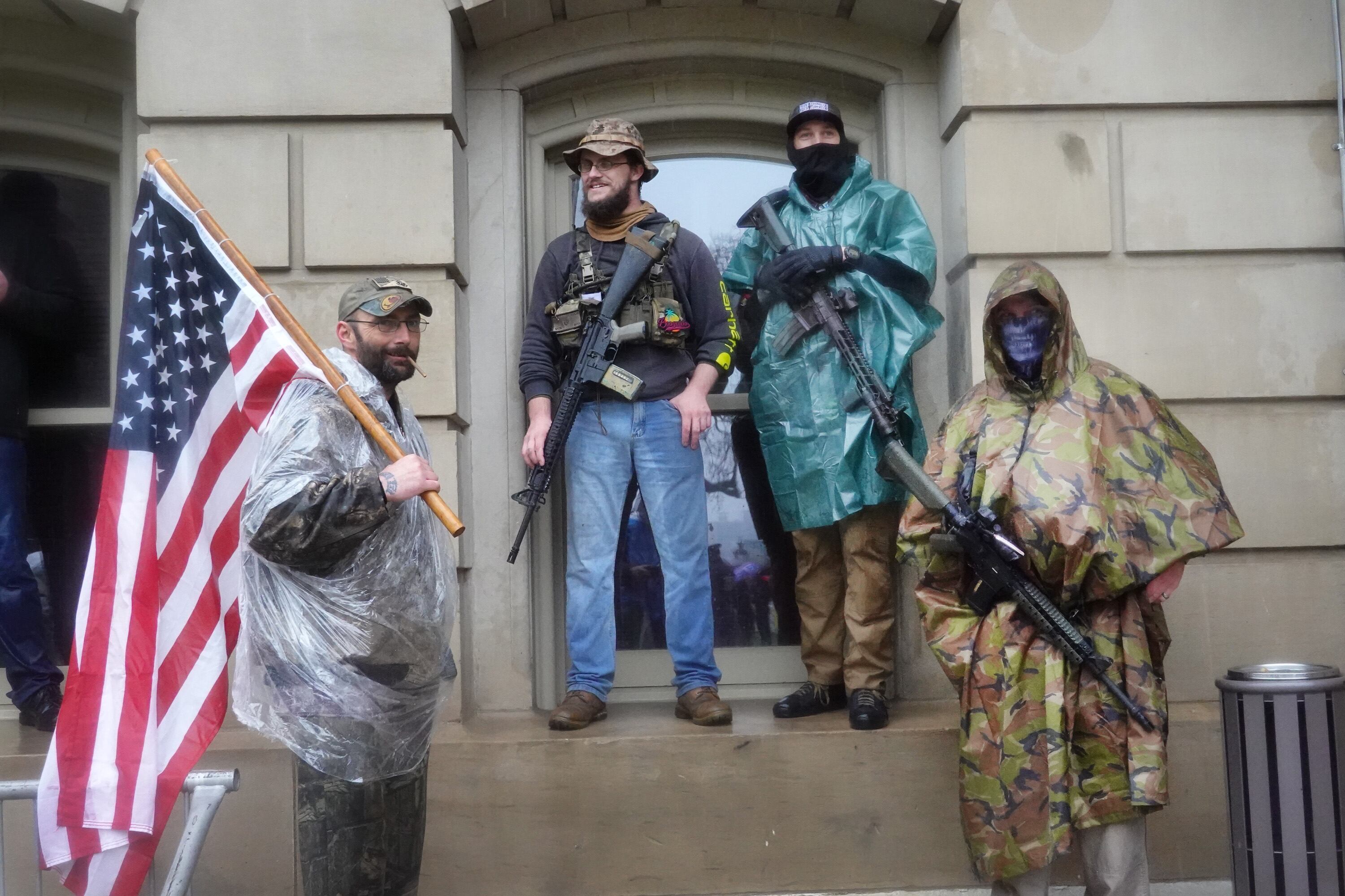 Armed protesters protest against measures to prevent Covid-19 infections in Michigan, in May 2020.