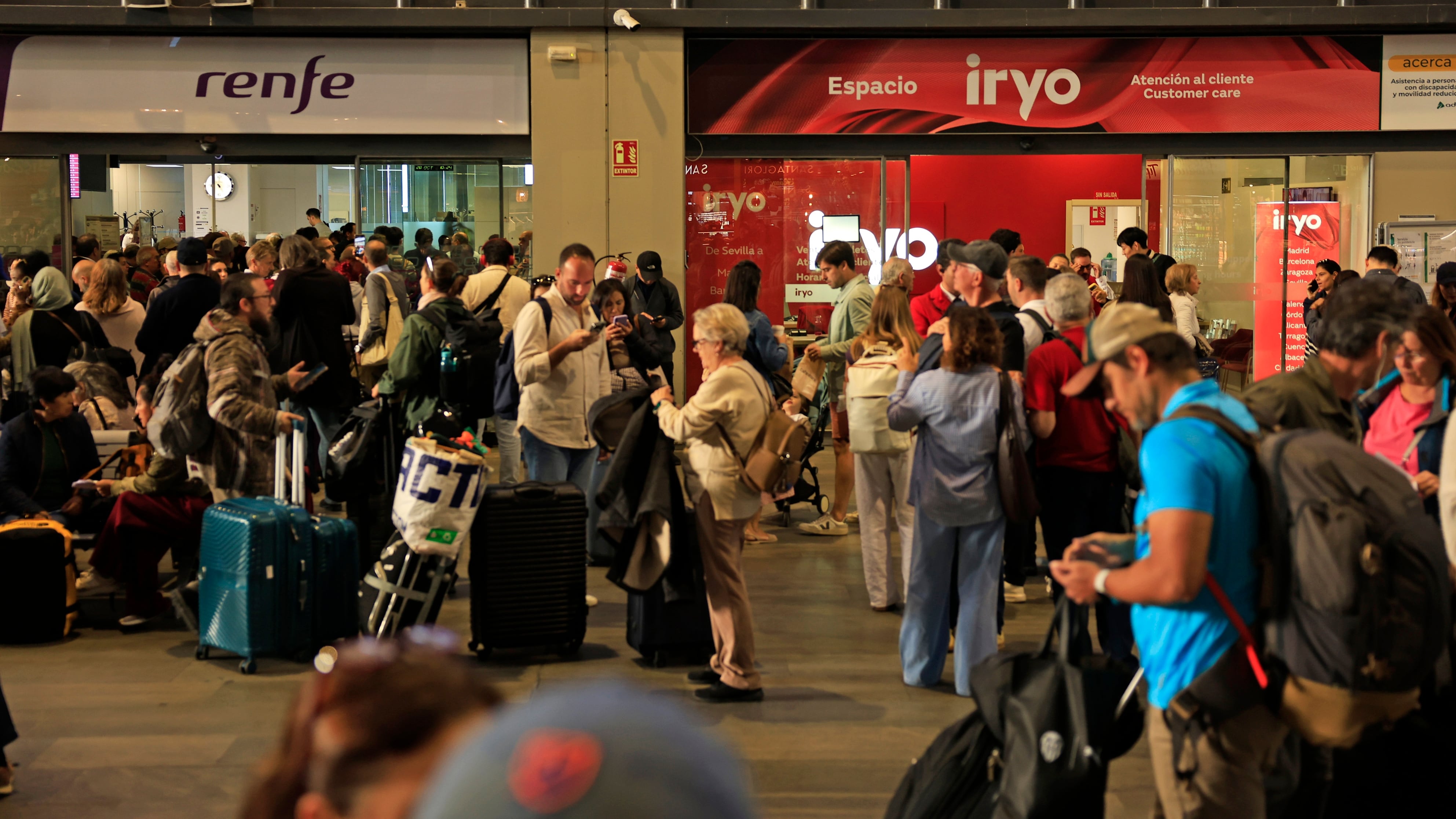 Passengers at the Santa Justa train station in Seville following the train accident involving two high-speed trains that occurred in Toledo.
