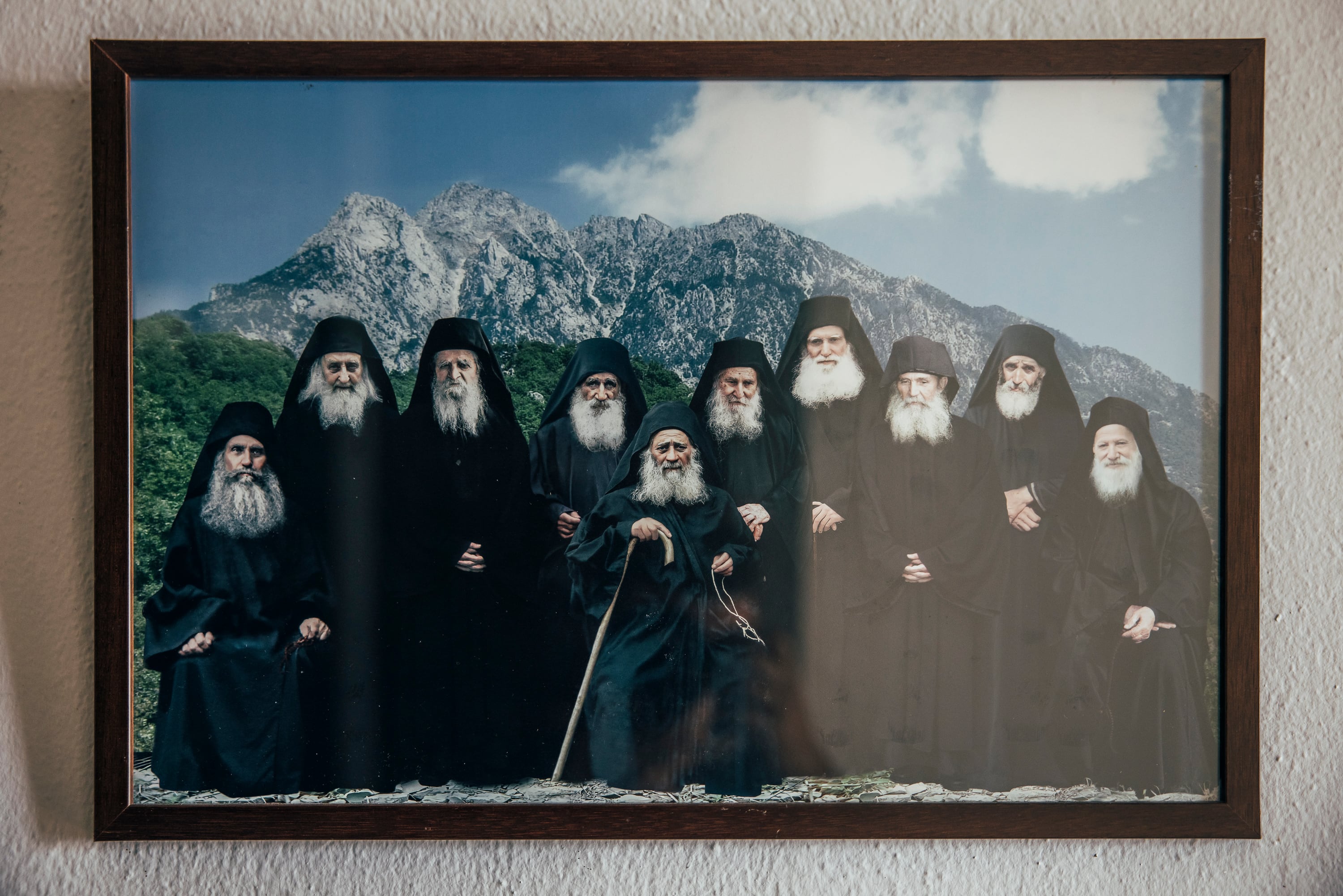 Photograph montage of various monks who governed the monasteries of Mount Athos, hung on a wall of the Monastery of Saint Gregory.