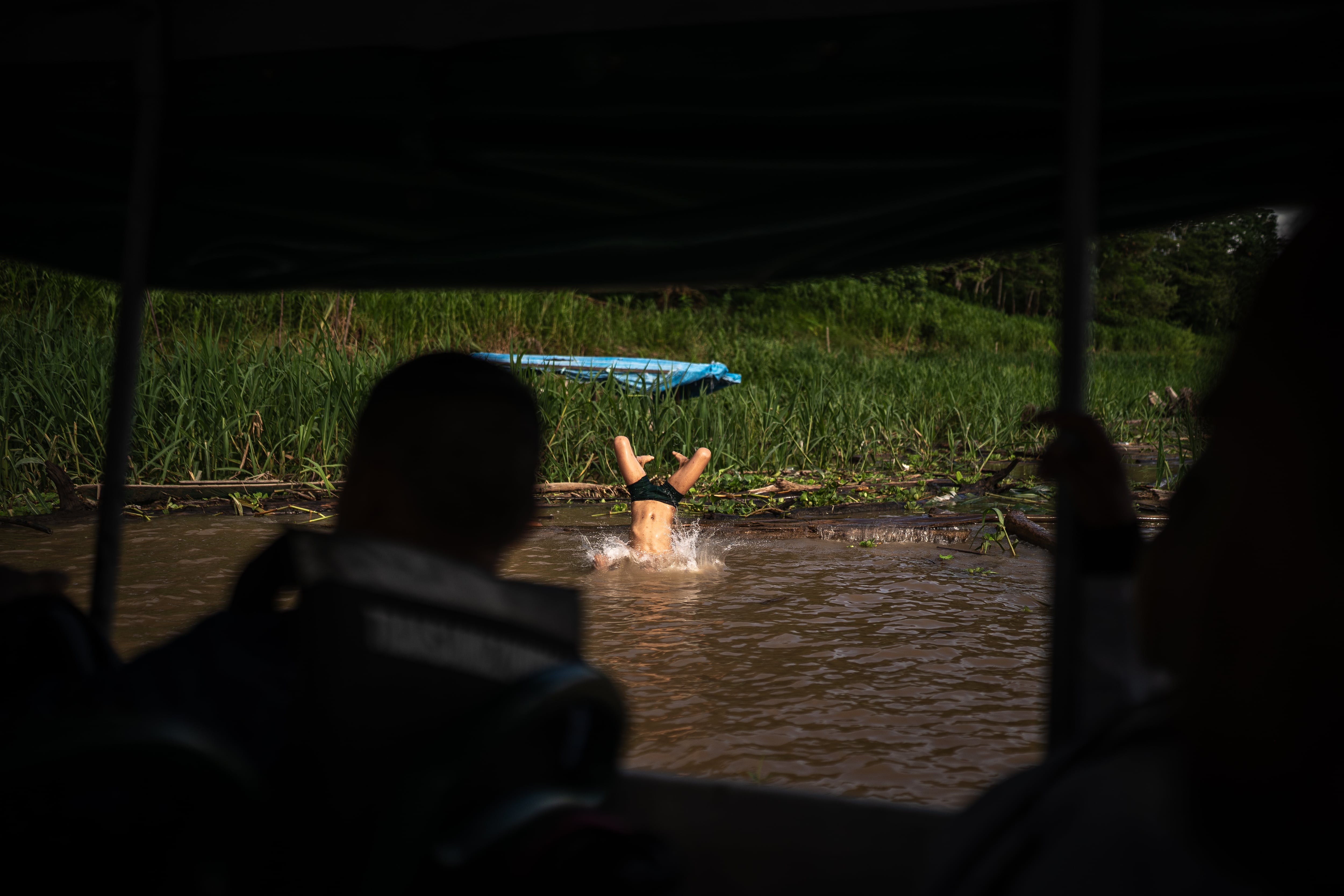 Children play in the Amazon River in the Colombian Amazon on December 13, 2024.