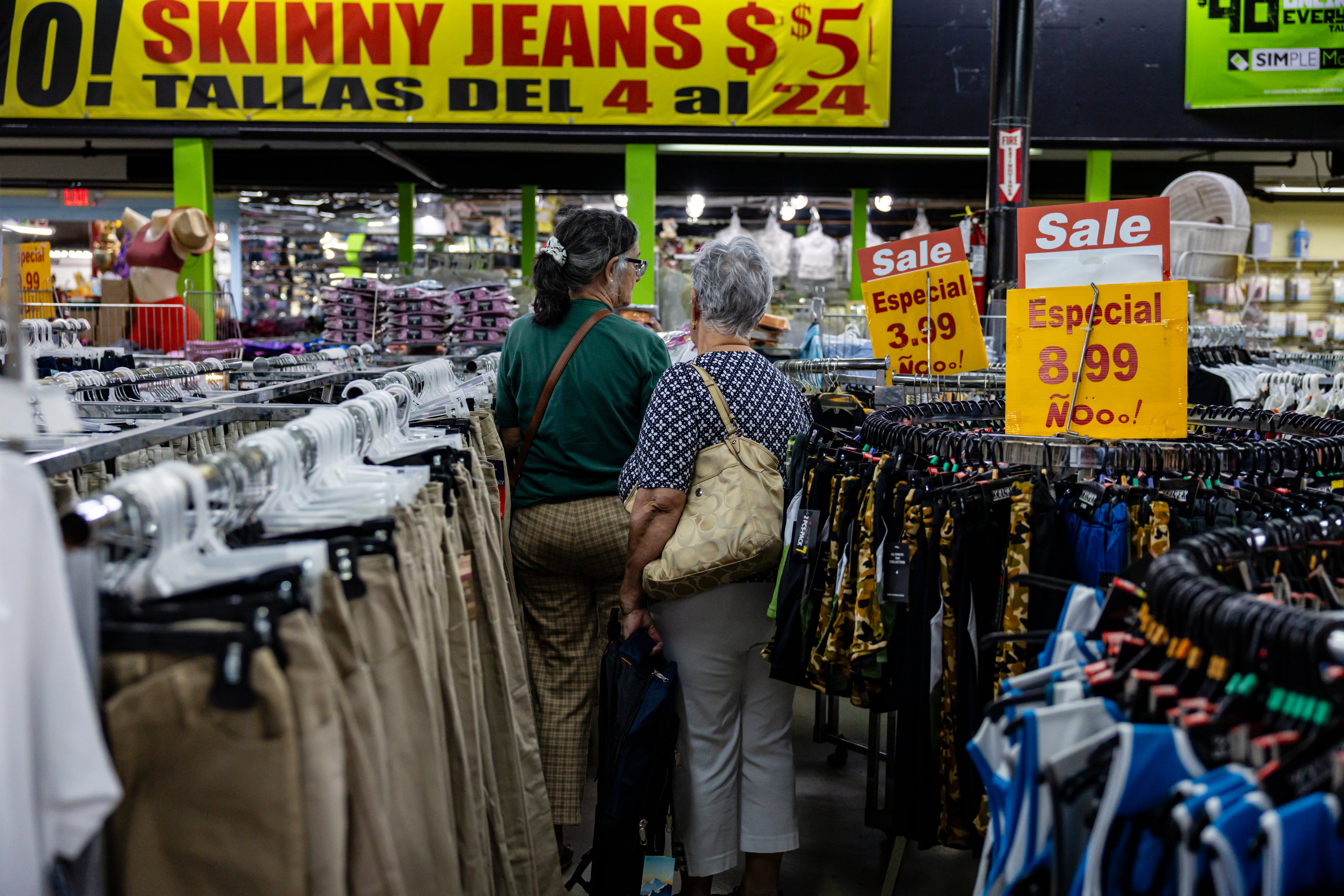 Customers check merchandise at the Ñooo Qué Barato store.