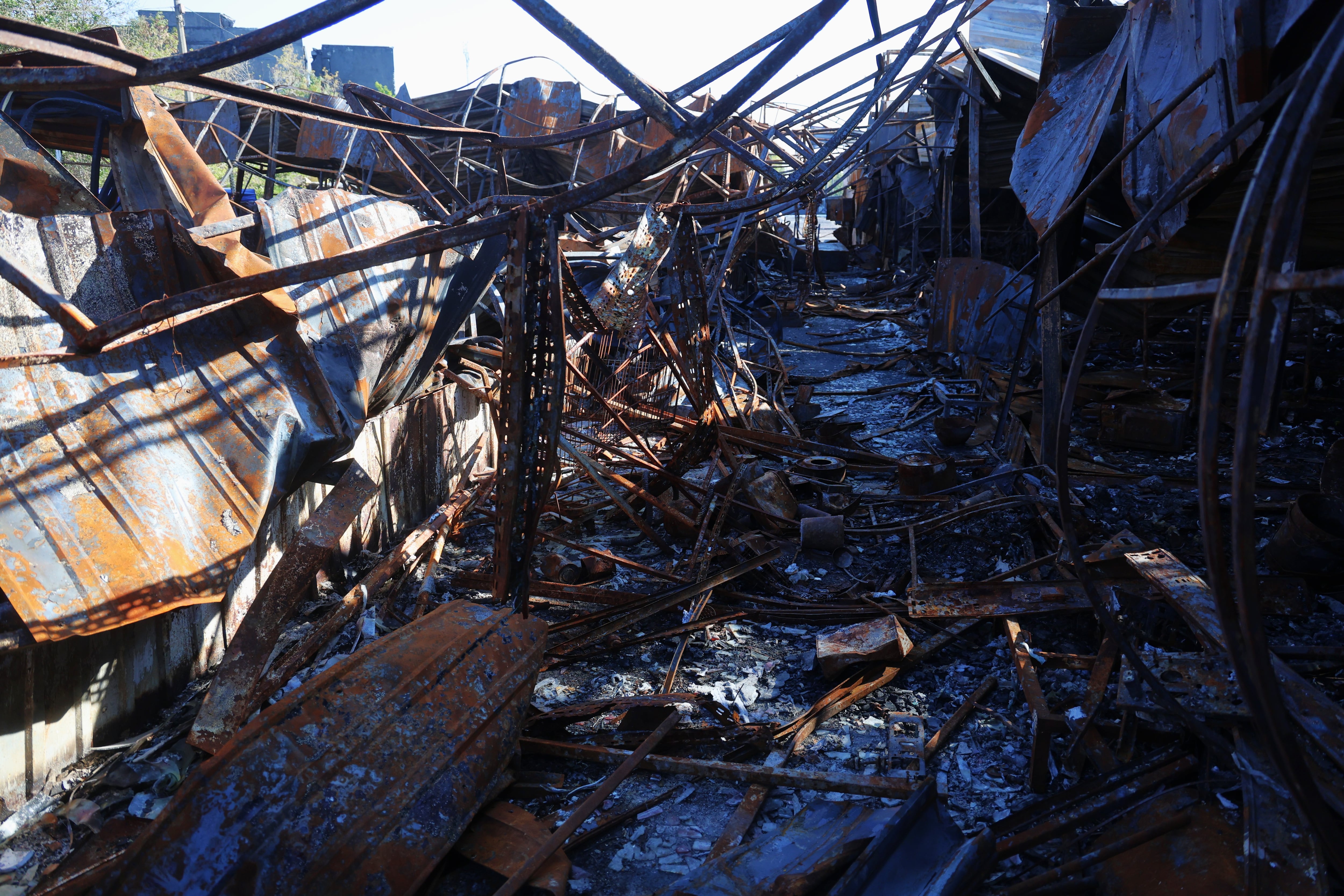 A view of one section of the Pochaina market after a Russian bombing raid.