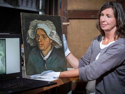 Lesley Stevenson of the National Galleries of Scotland holding 'Head of a Peasant Woman' alongside an X-ray image of the hidden van Gogh self-portrait.