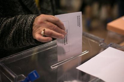 A woman voting in Barcelona. The outcome of the election will hinge on the undecided voters and the abstainers who choose to go to the polls today.